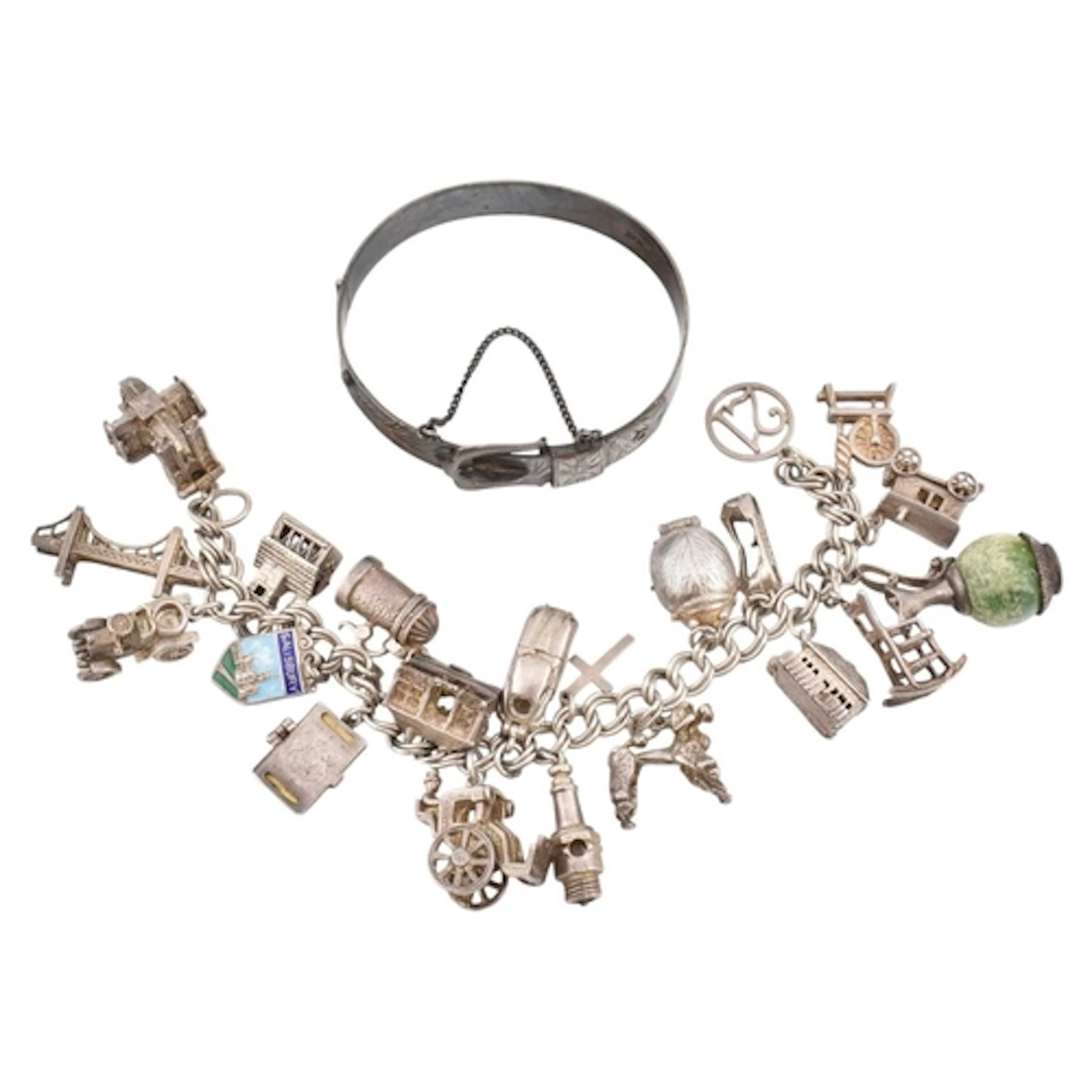 A silver and white metal charm bracelet with Fab Four Beatle...