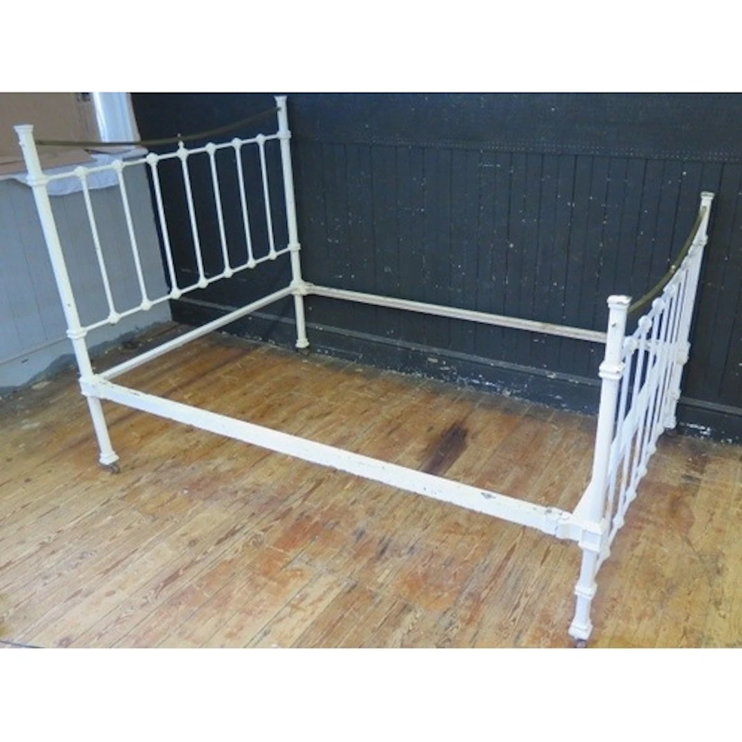 A Victorian painted cast iron and brass double bed head and ...