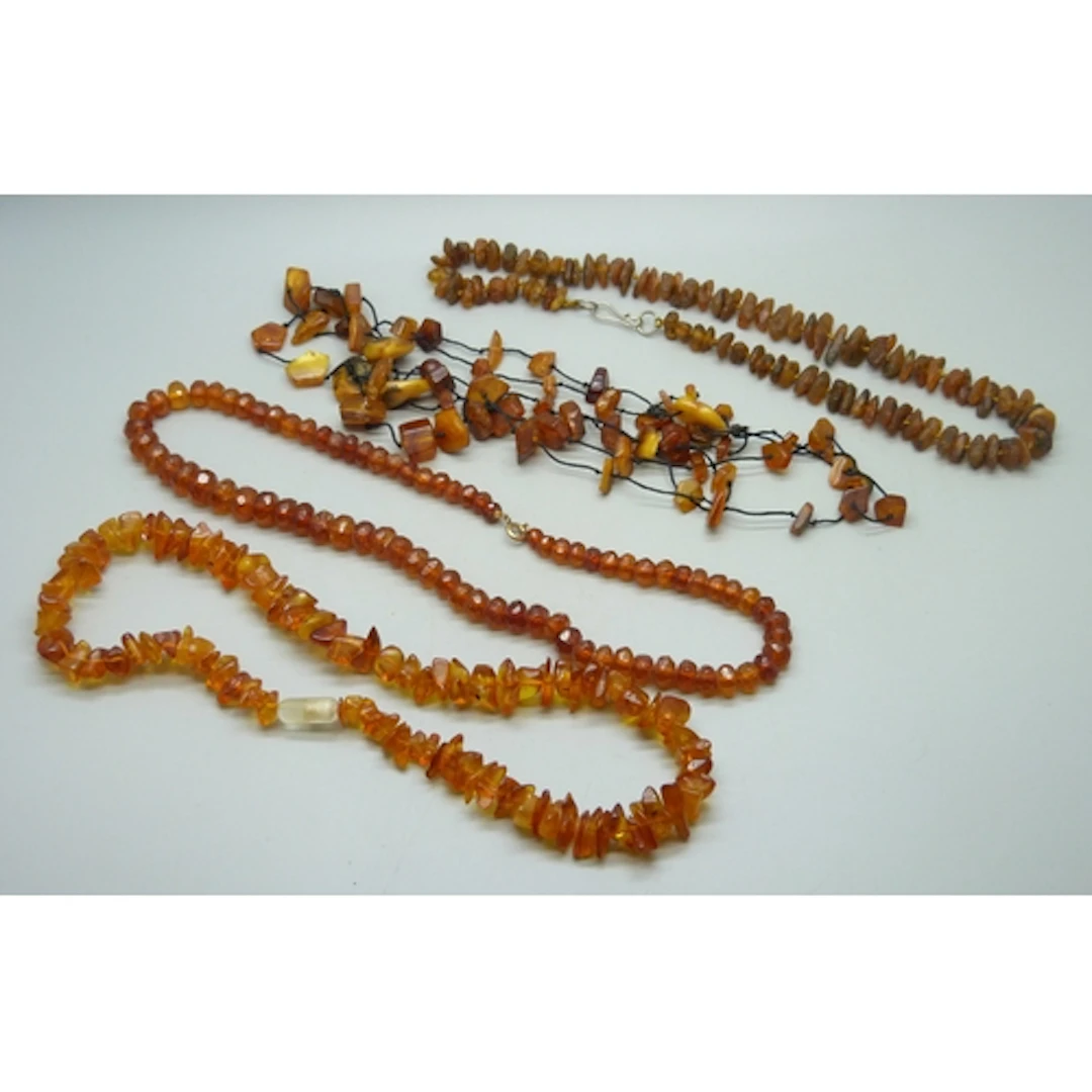 Four amber necklaces, 135g total