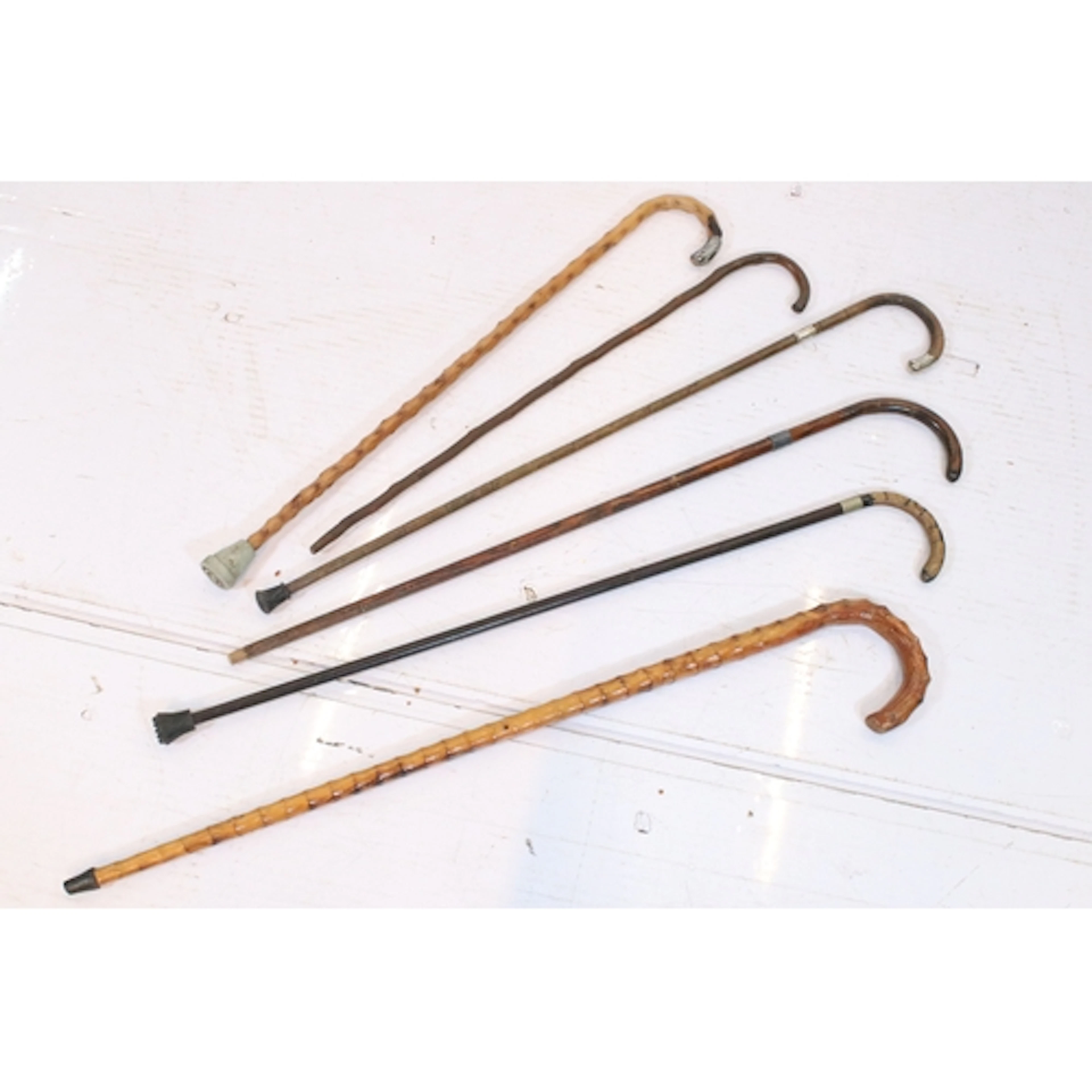 Group of six antique and later walking sticks, comprising tw...