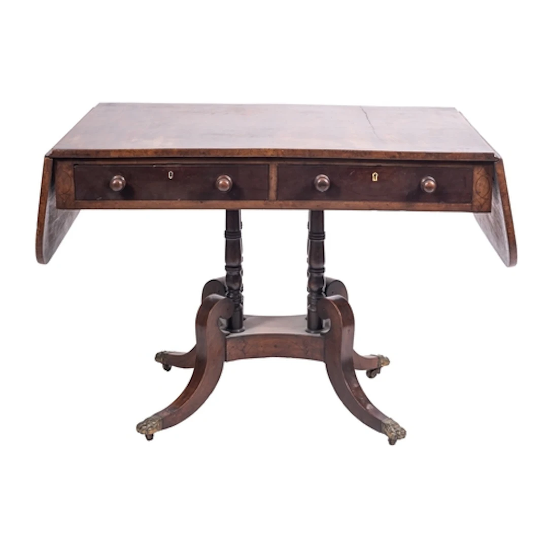 A George IV mahogany and crossbanded sofa table, circa 1825;...