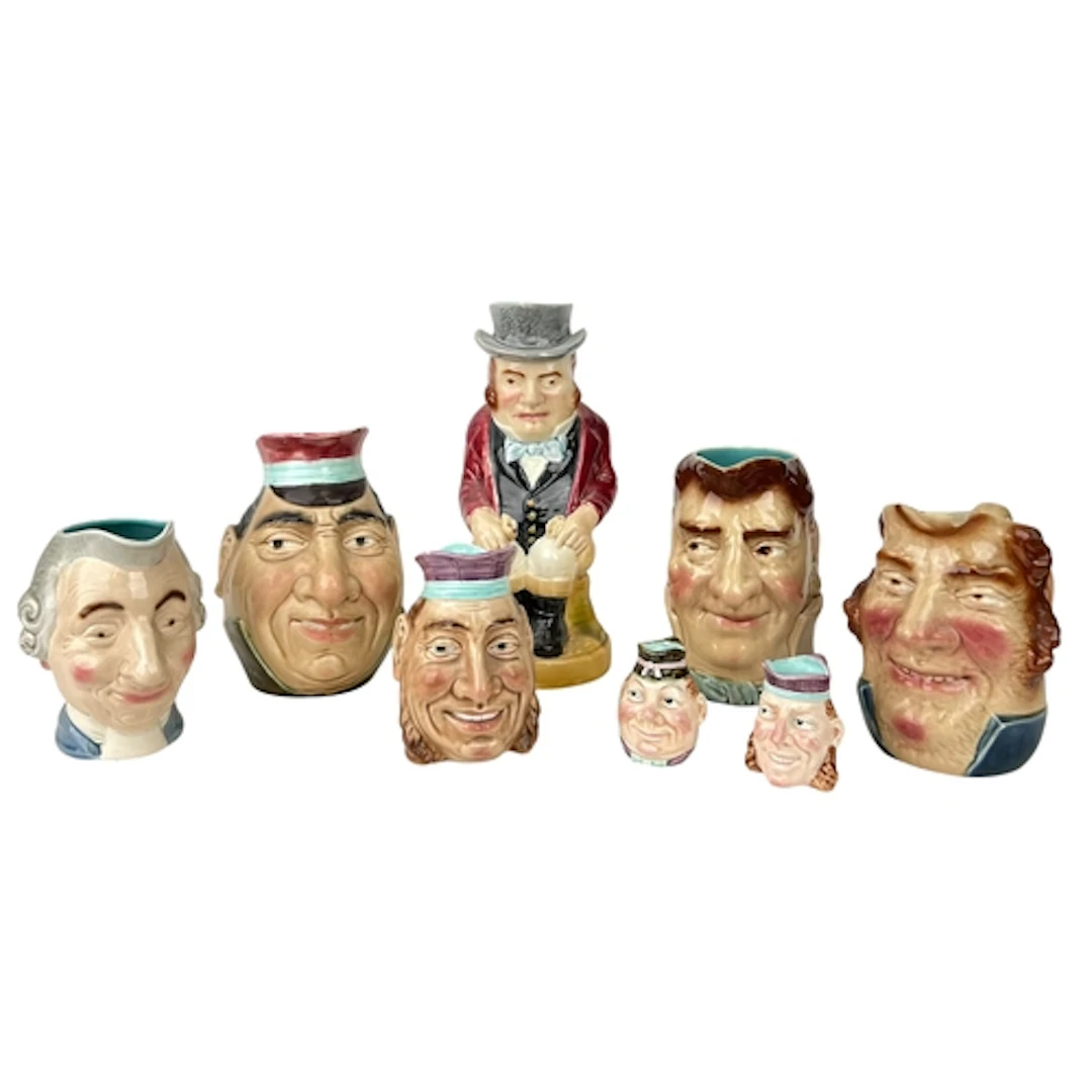 A LARGE GROUP OF FRENCH SARREGUEMINES MAJOLICA CHARACTER JUG...