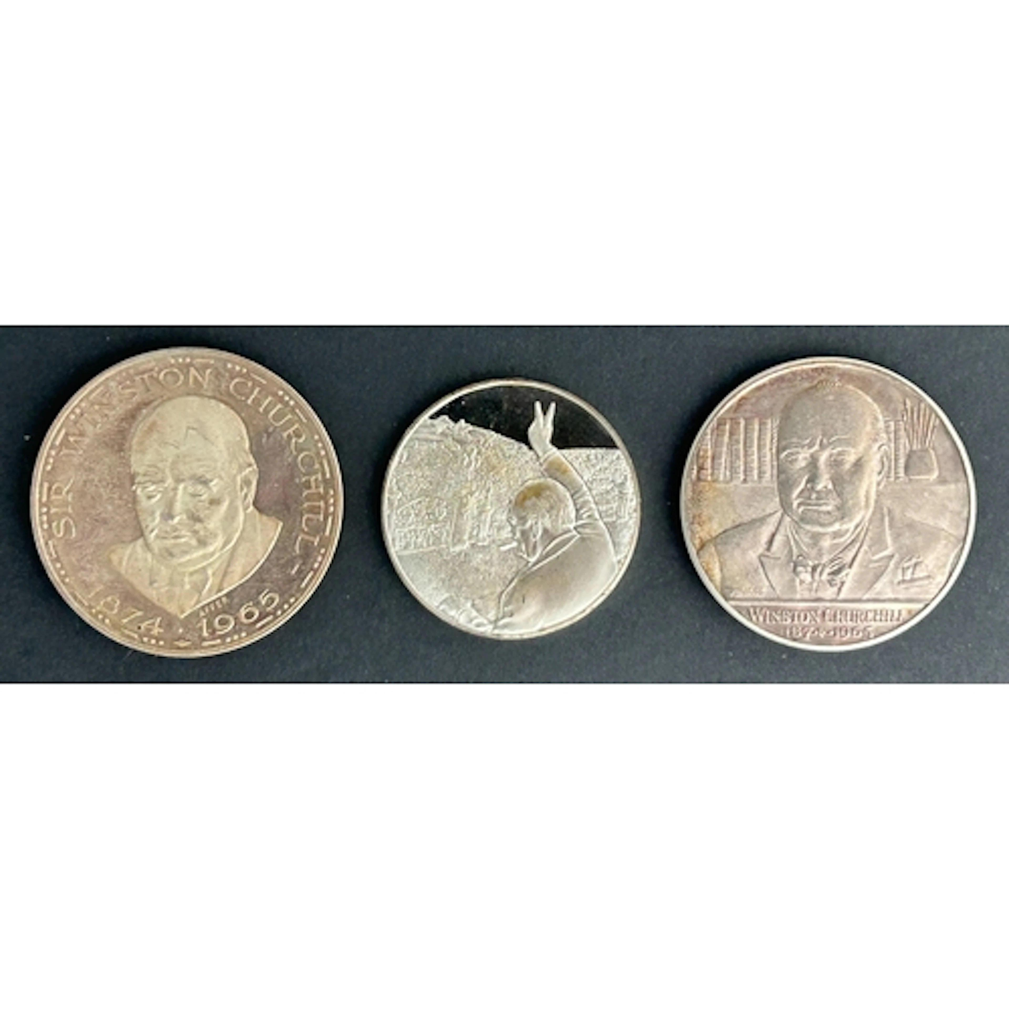 A group of three silver commemorative medals relating to Win...