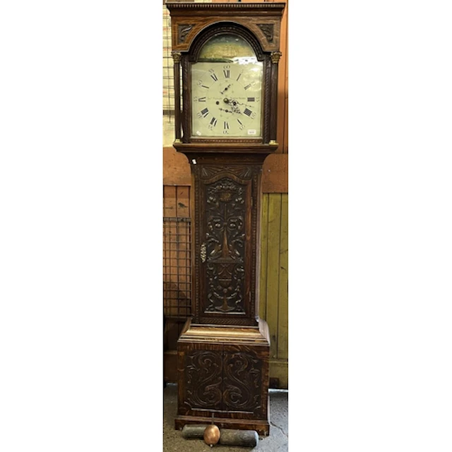 Antique oak and inlaid grandfather clock with heavily carved...