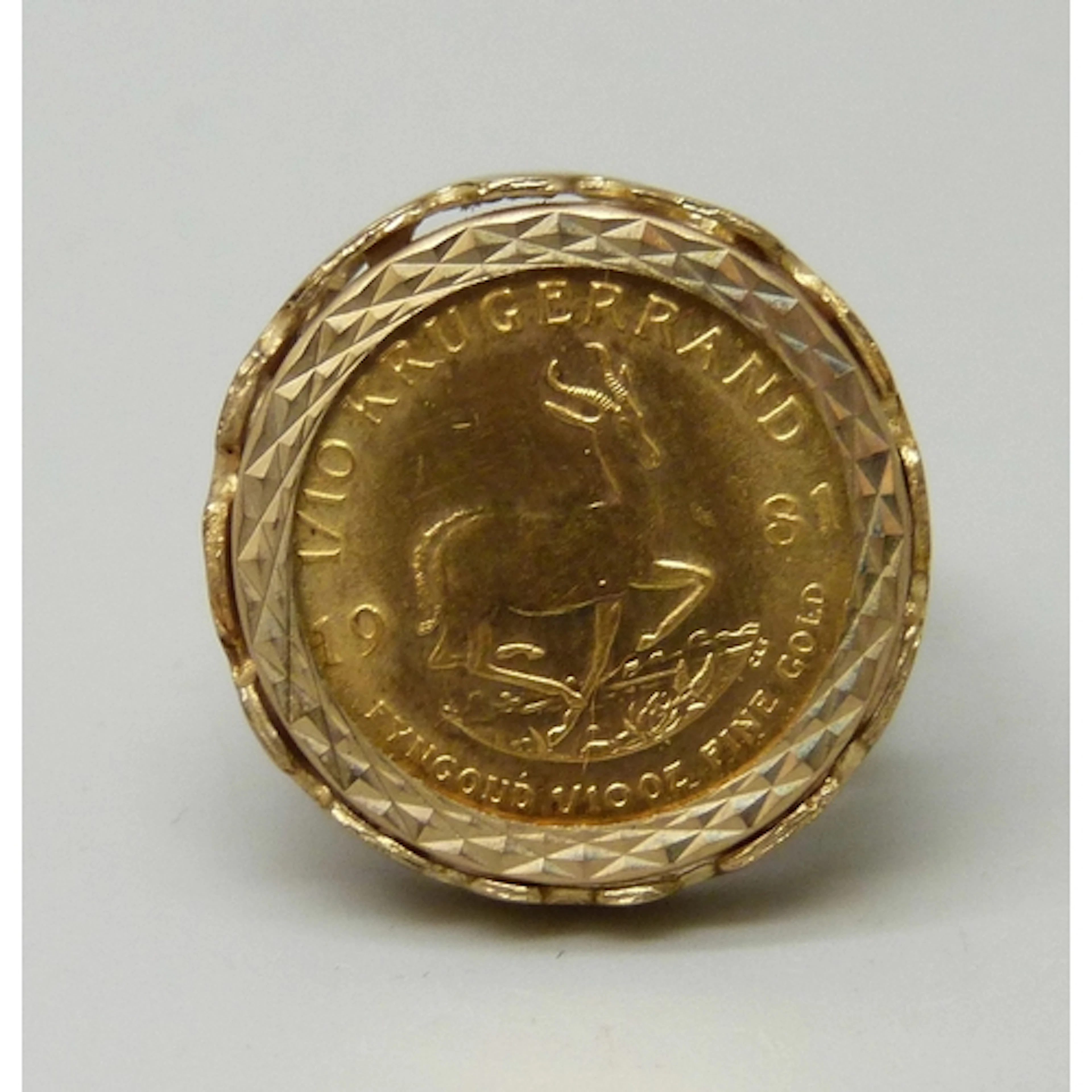 A 9ct gold mounted 1/10oz fine gold Krugerrand coin ring, 6....