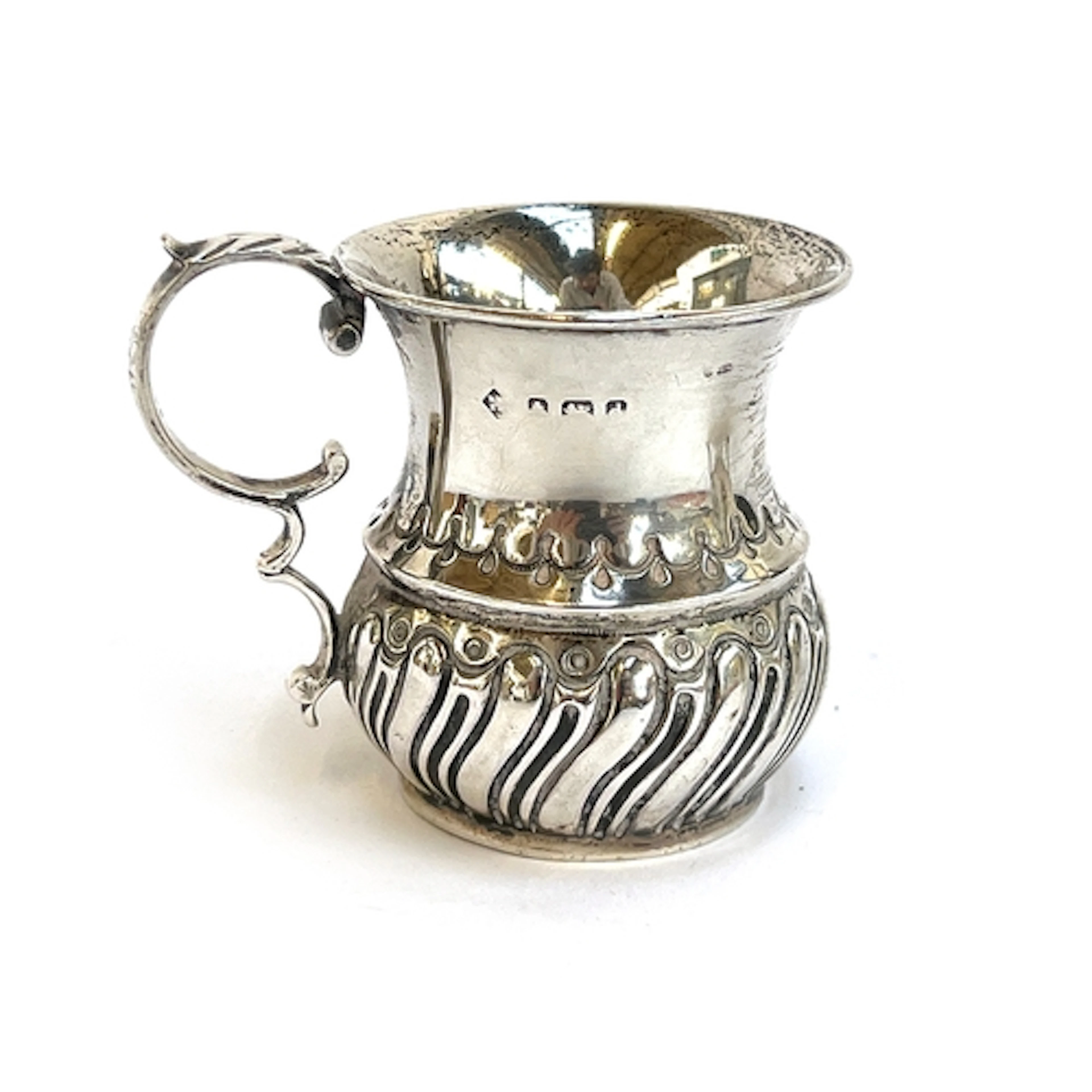 A small silver mug, with acanthus capped scroll handle and h...