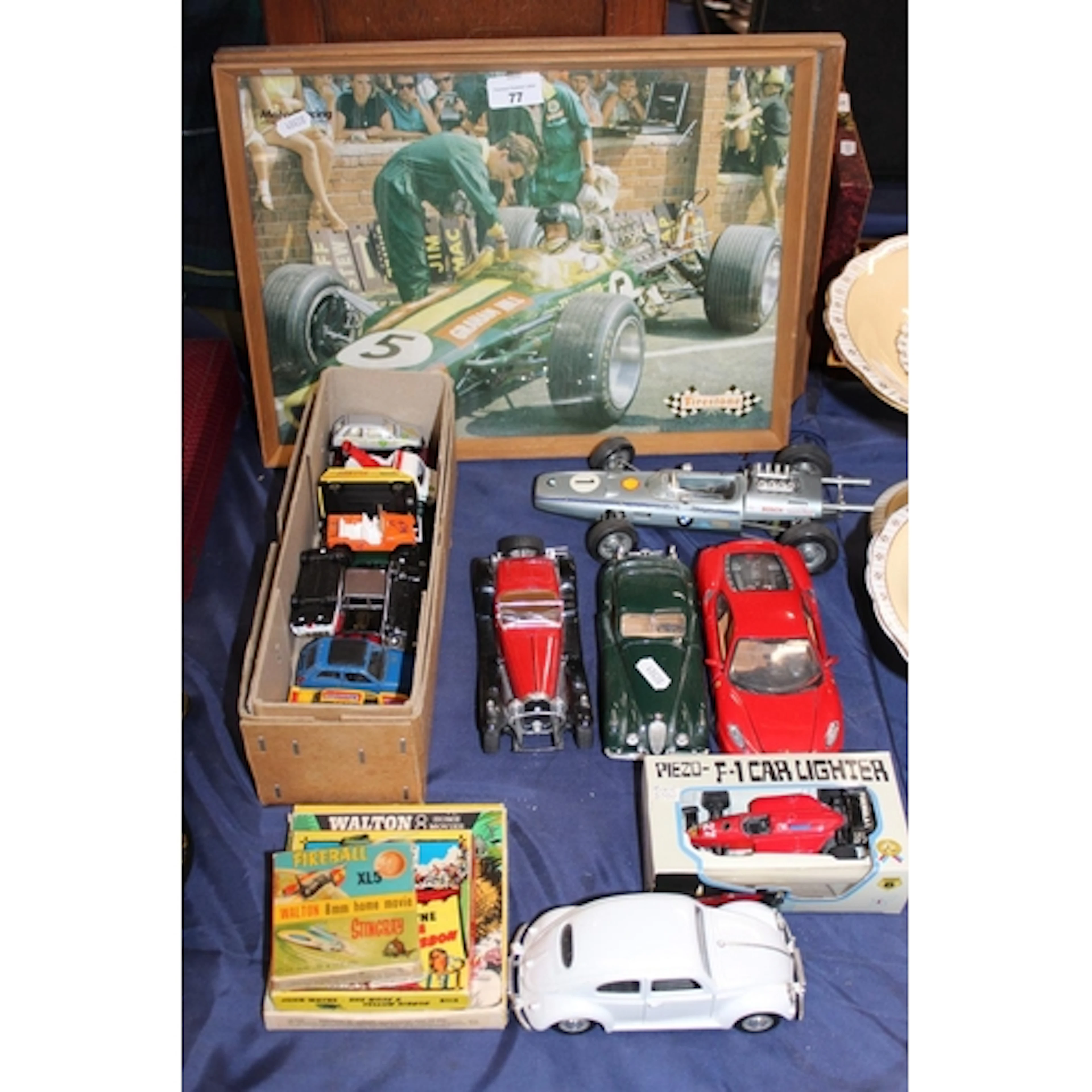 Playworn model cars, two prints of Graham Hill and Jim Clark...