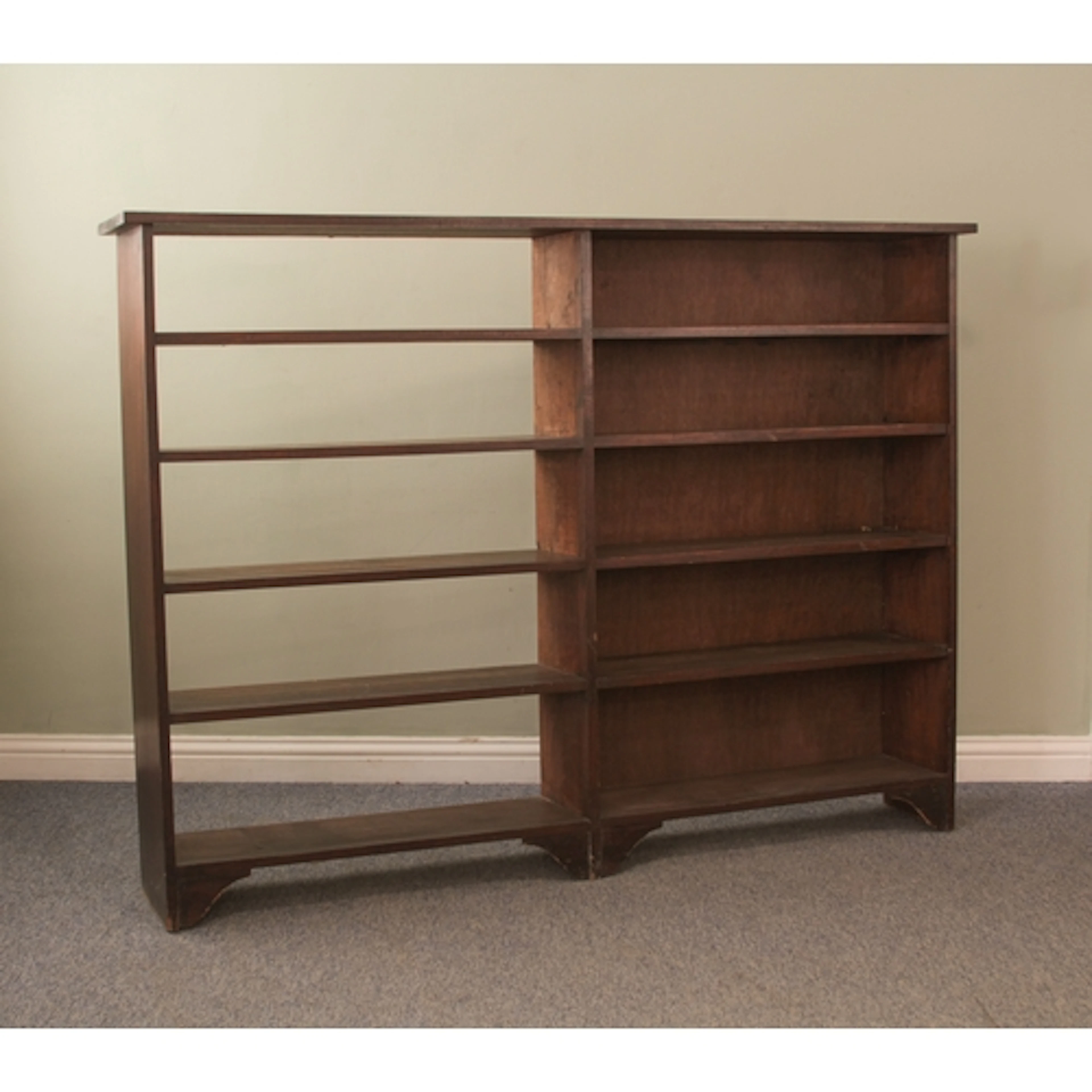 A mid-20th century mahogany double bookcase - the left back ...