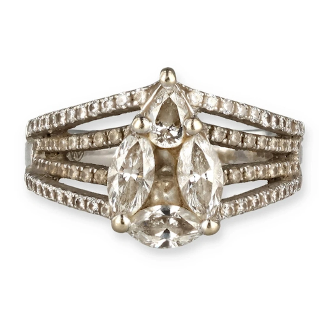 AN 18CT WHITE GOLD DIAMOND RING With pear shaped bezel, com...