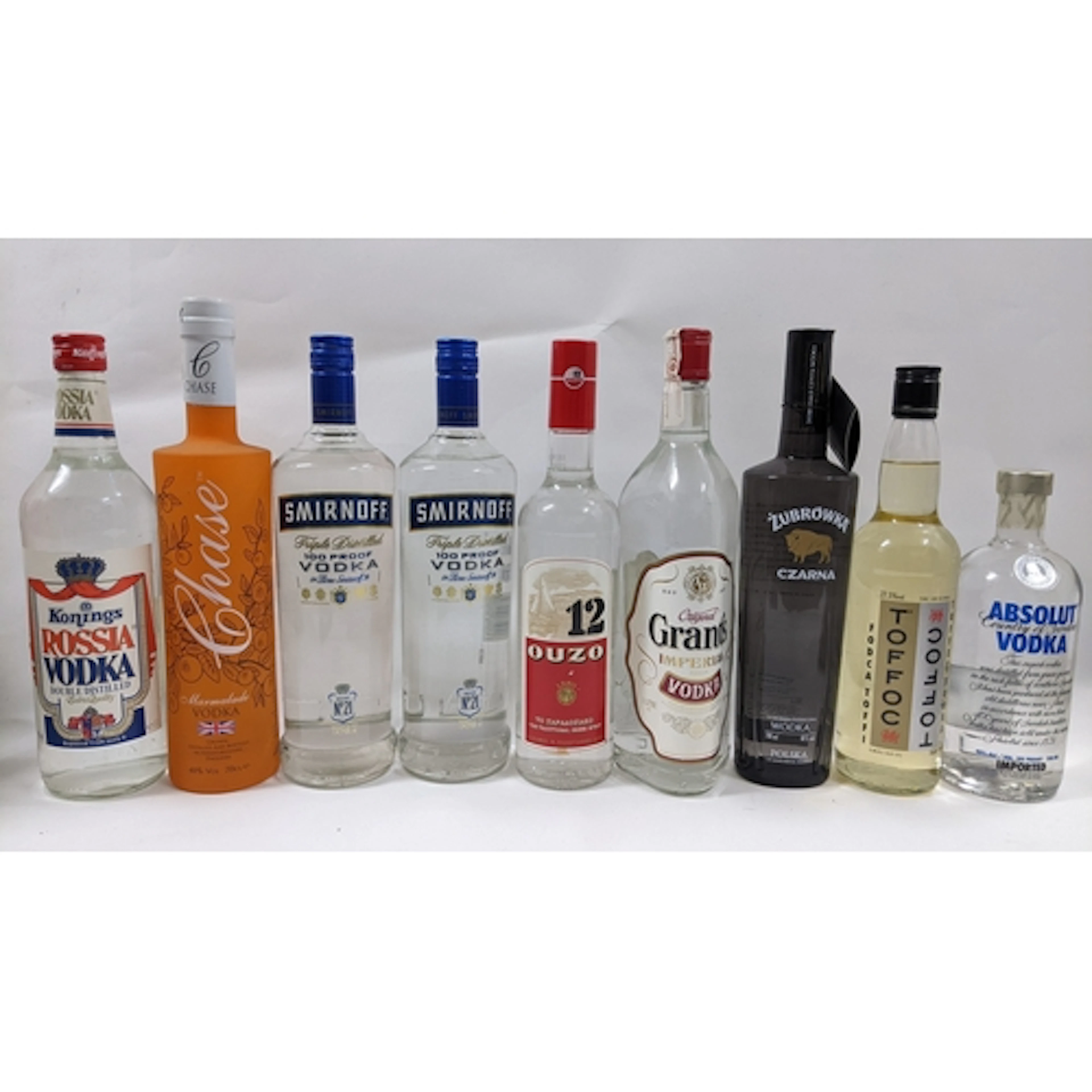 A group of nine bottles of vodka and spirits, comprising: Ko...