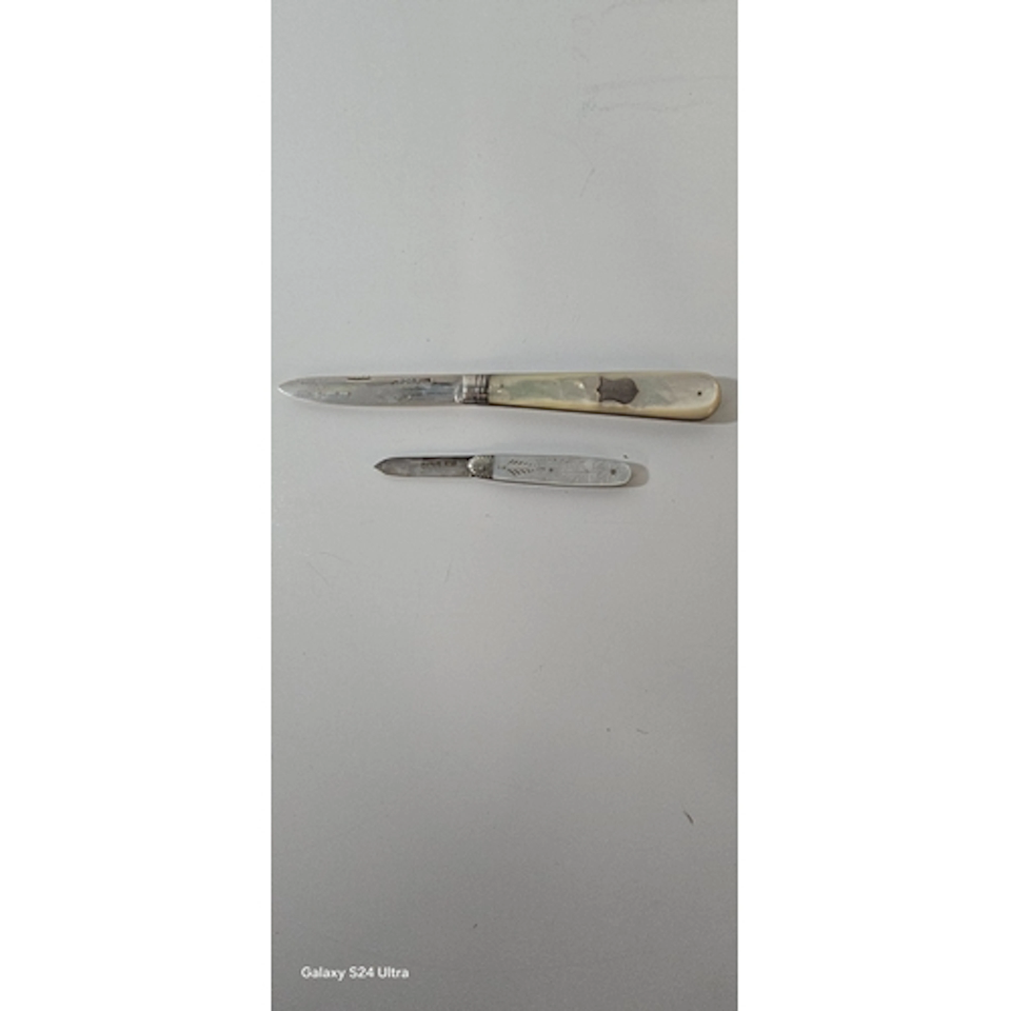 A large folding silver fruit knife, blade 7.2cms hall marked...