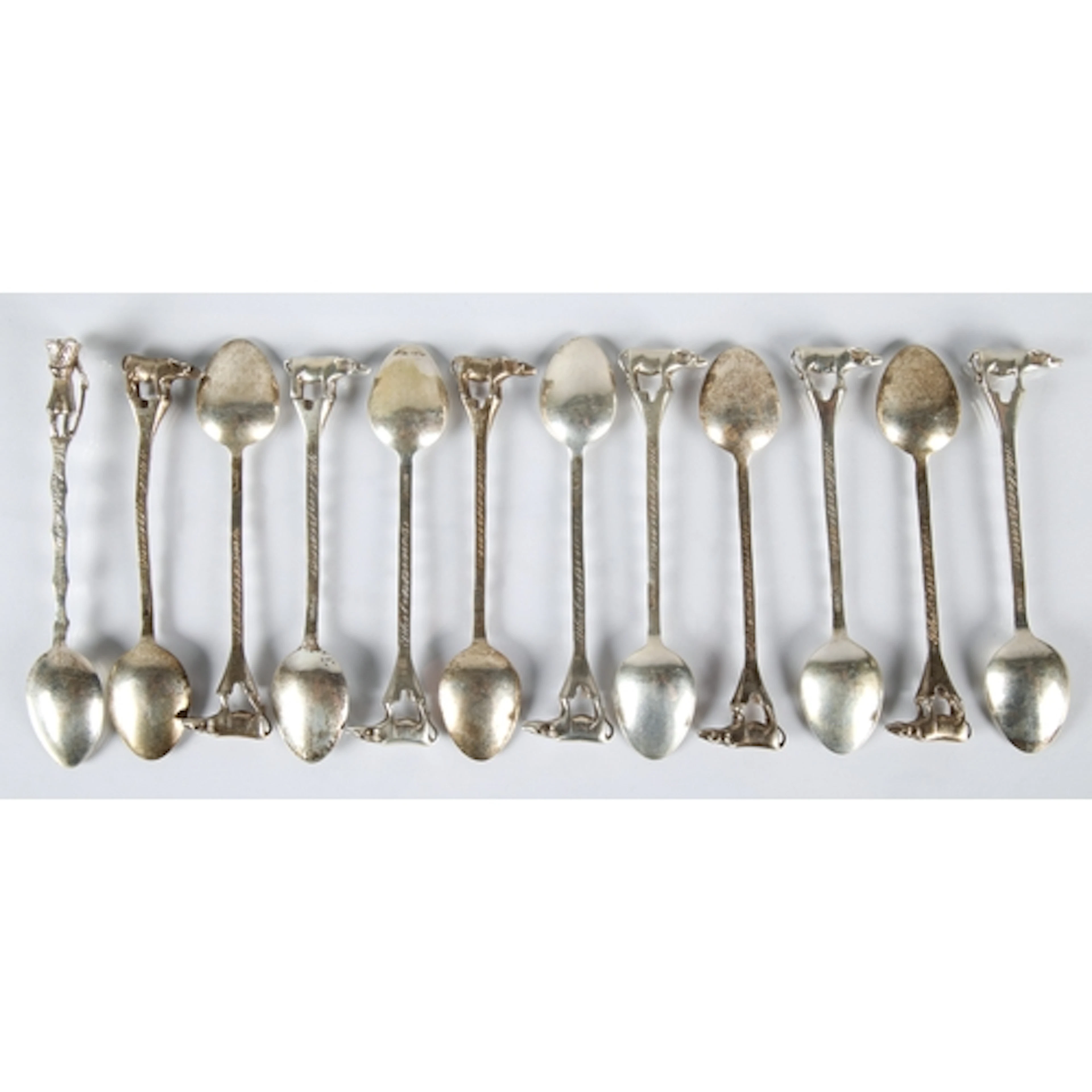 Eleven matching South East Asian sterling silver souvenir te...