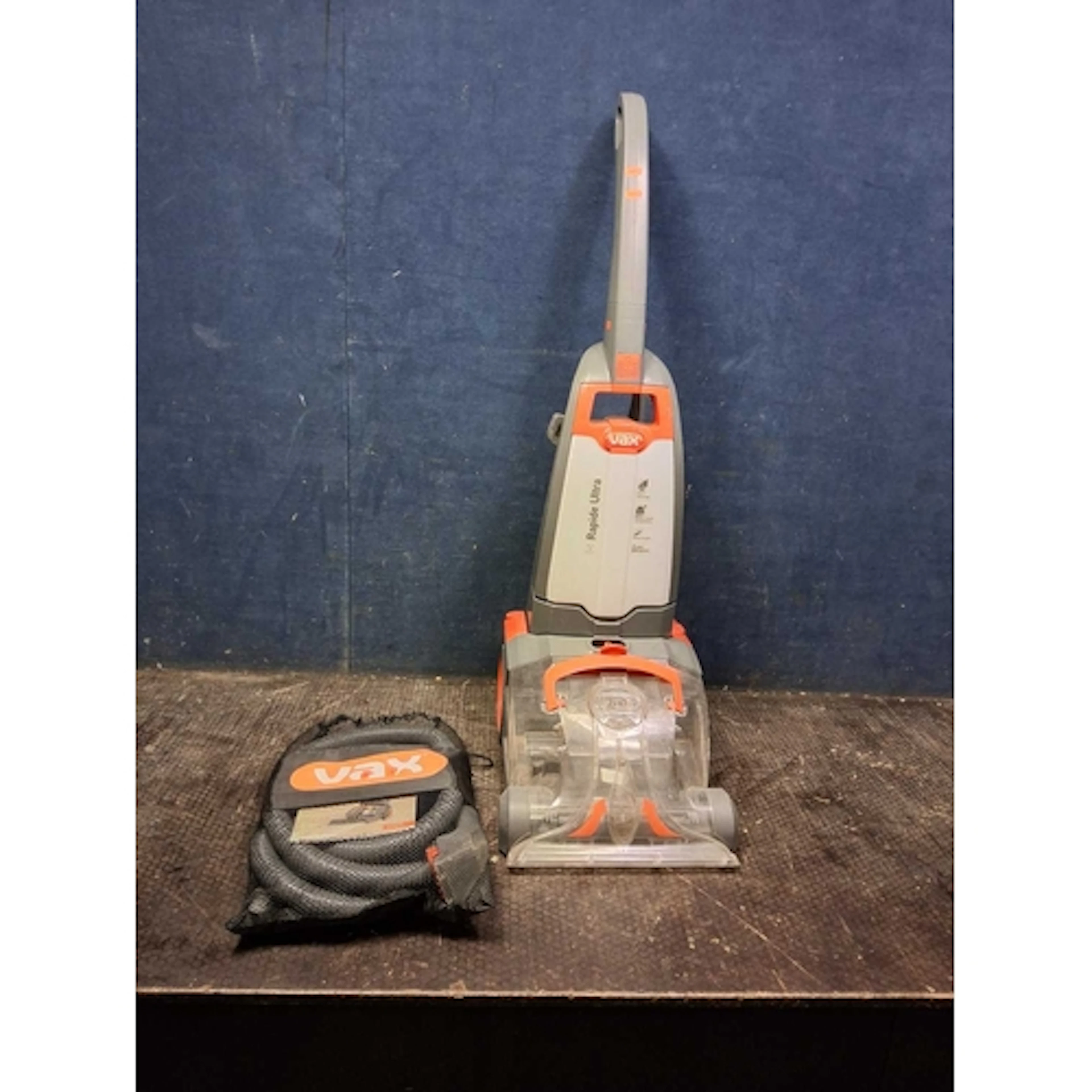 A VAX RAPIDE ULTRA CARPET WASHER with a bag of accessories (...