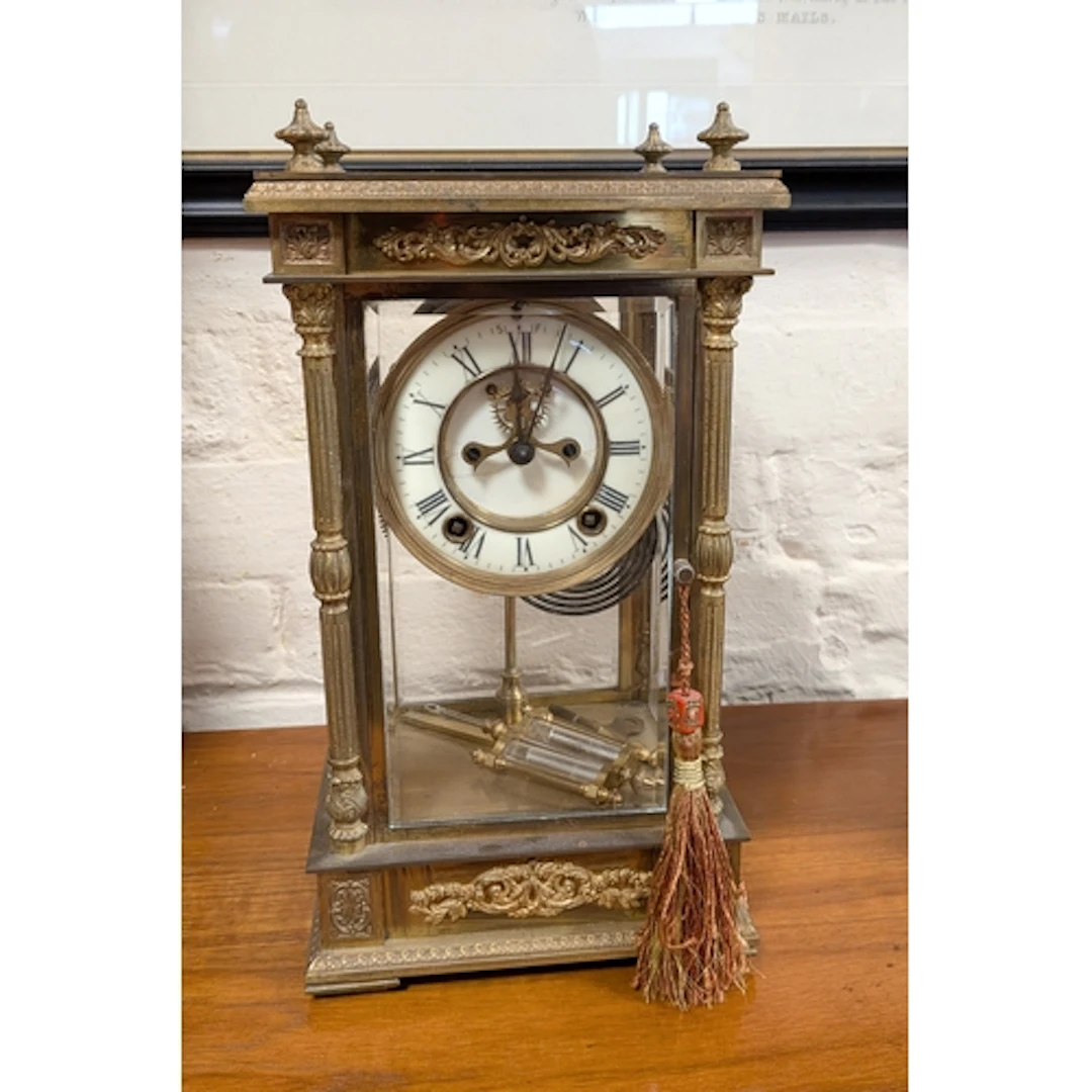 A Victorian striking mantel clock in glass and brass case, f...