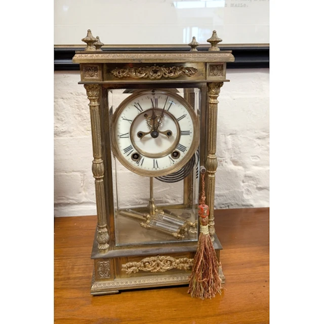 A Victorian striking mantel clock in glass and brass case, f...