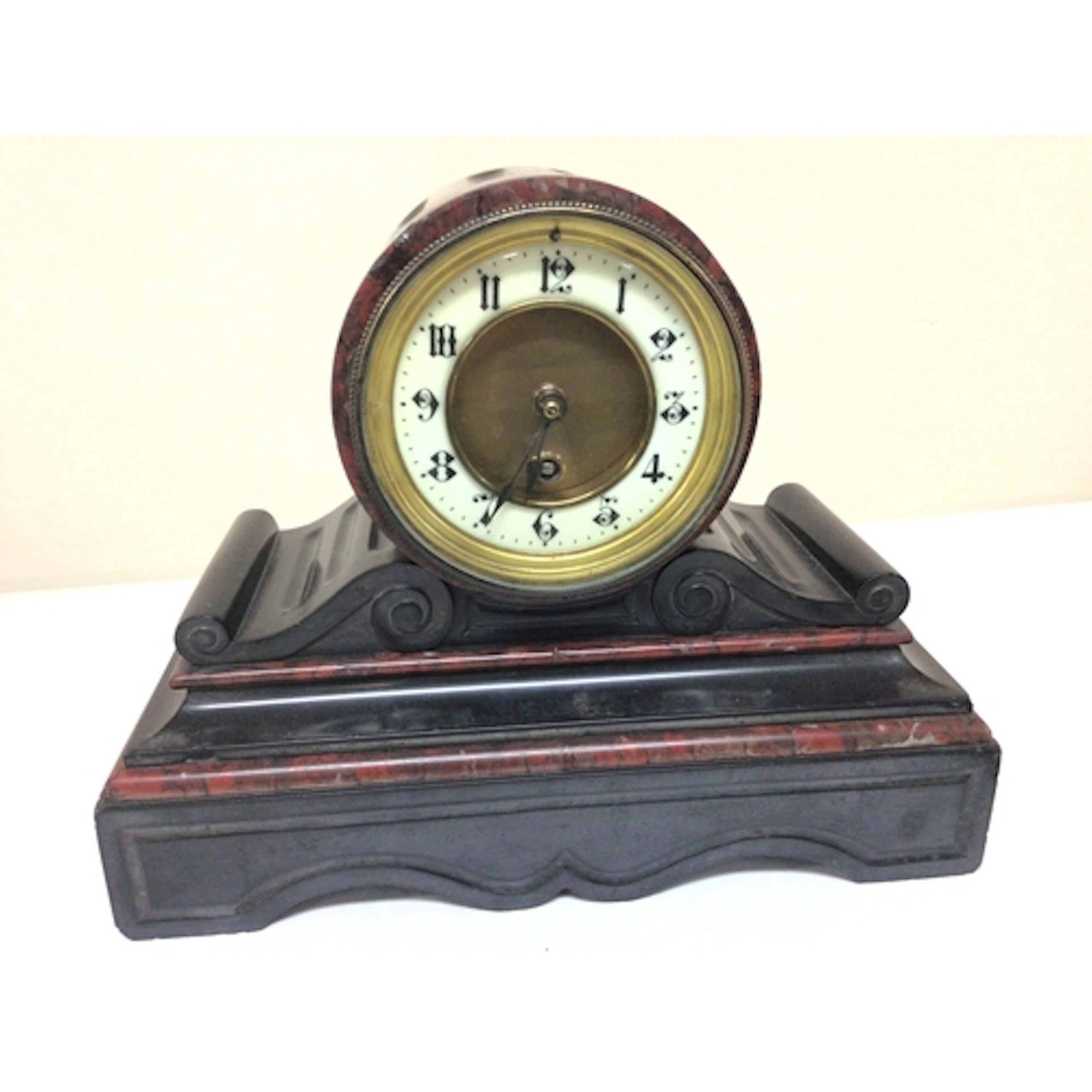 A black slate and marble Victorian mantel clock. 24cm high. ...
