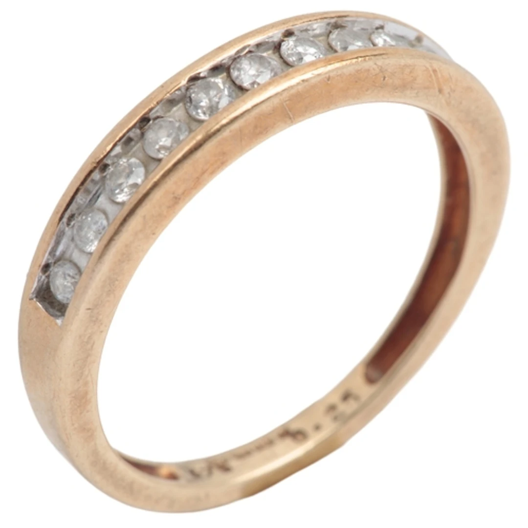 A diamond half hoop ring, set with a line of brilliant-cut d...