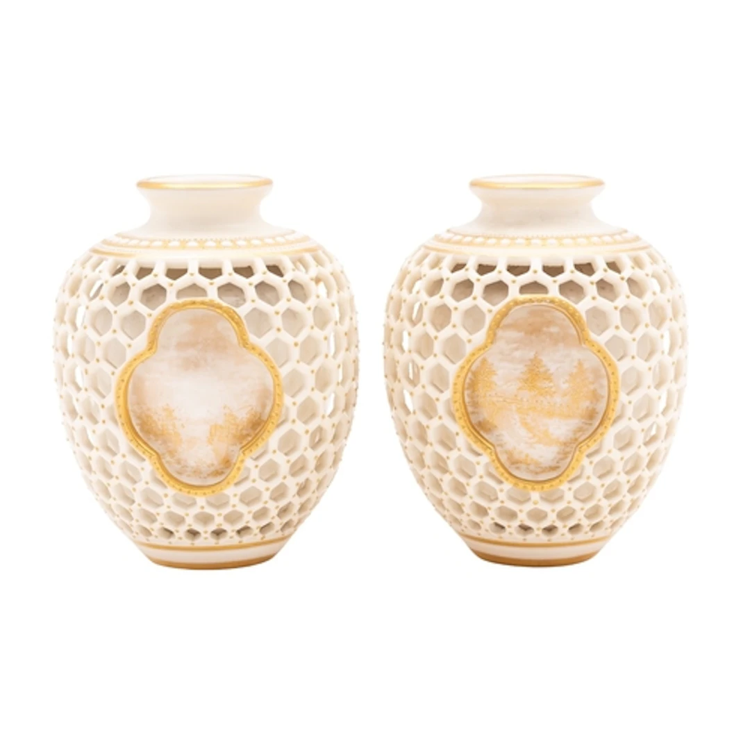 A pair of small Royal Worcester double-walled reticulated va...