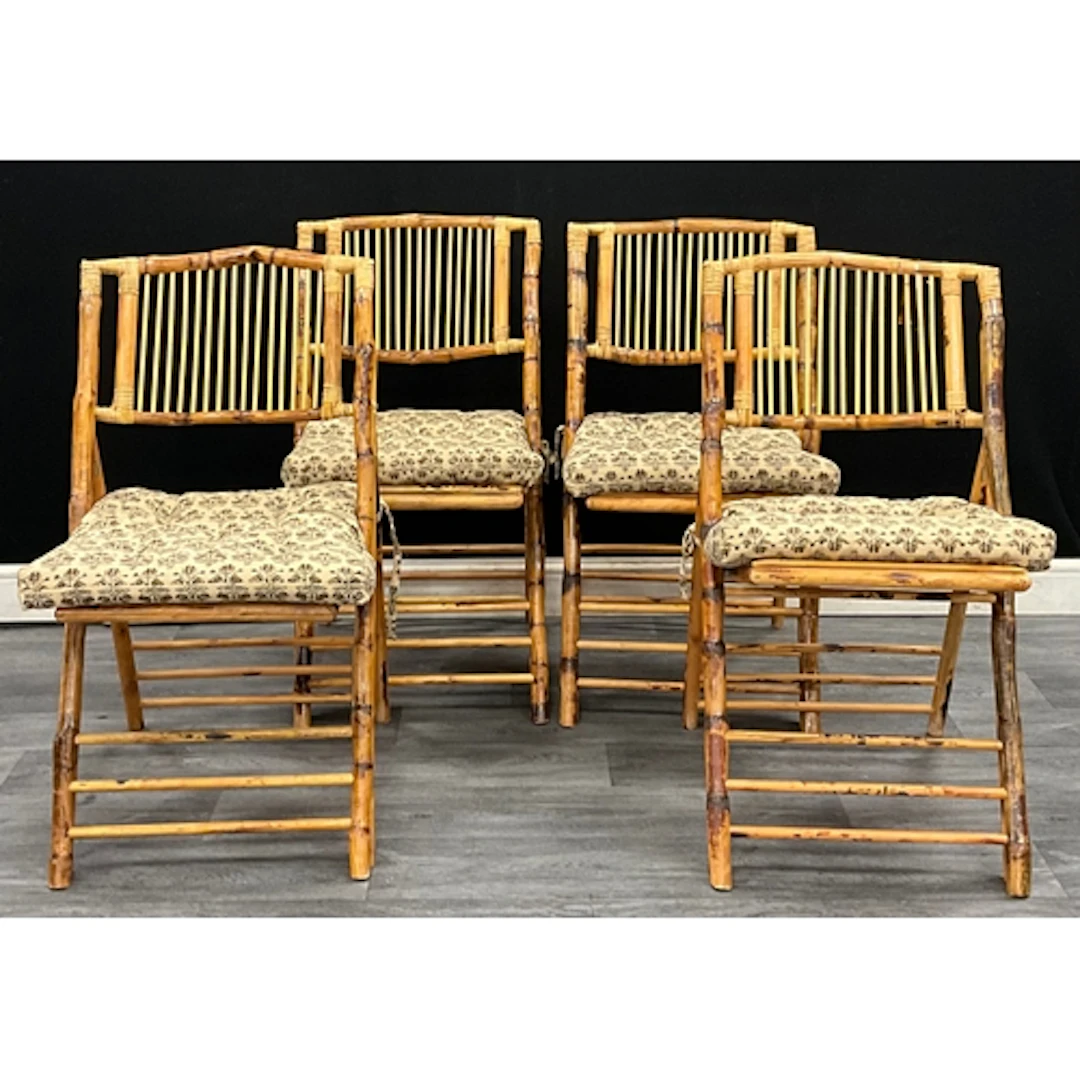 A set of four faux bamboo folding chairs with Madam Stolz se...
