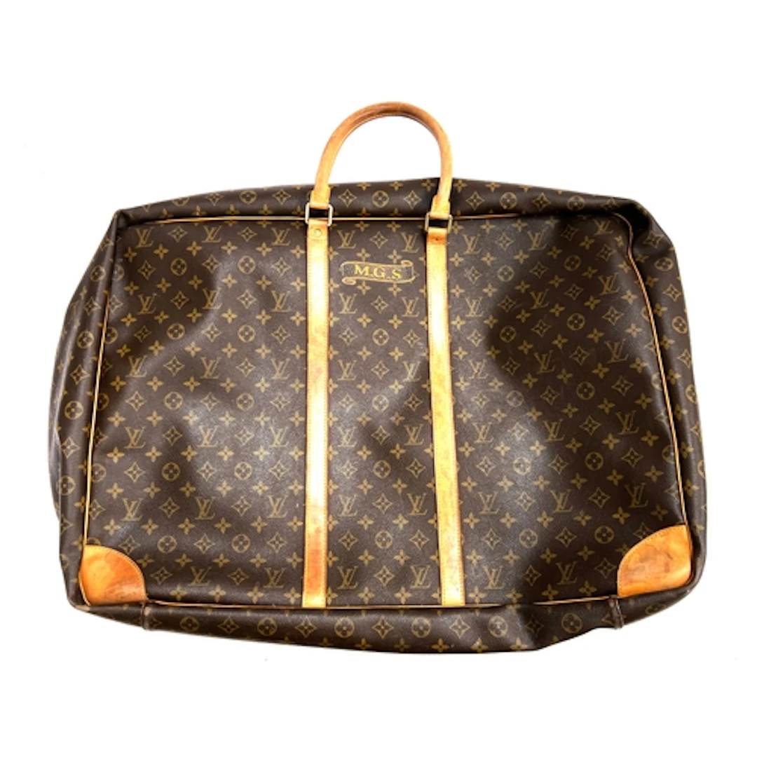 A Louis Vuitton leather suitcase or holdall, monogrammed MGS...