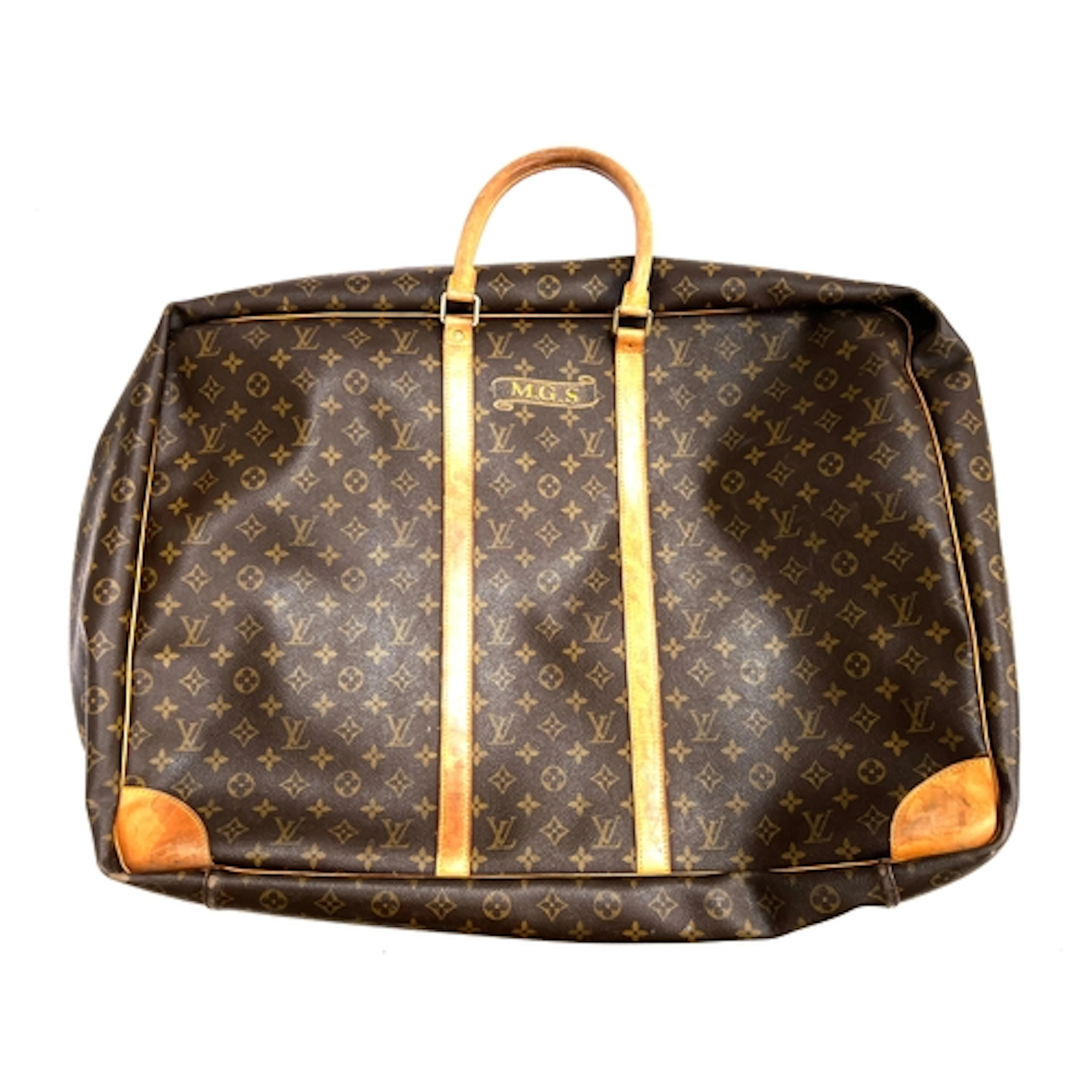 A Louis Vuitton leather suitcase or holdall, monogrammed MGS...