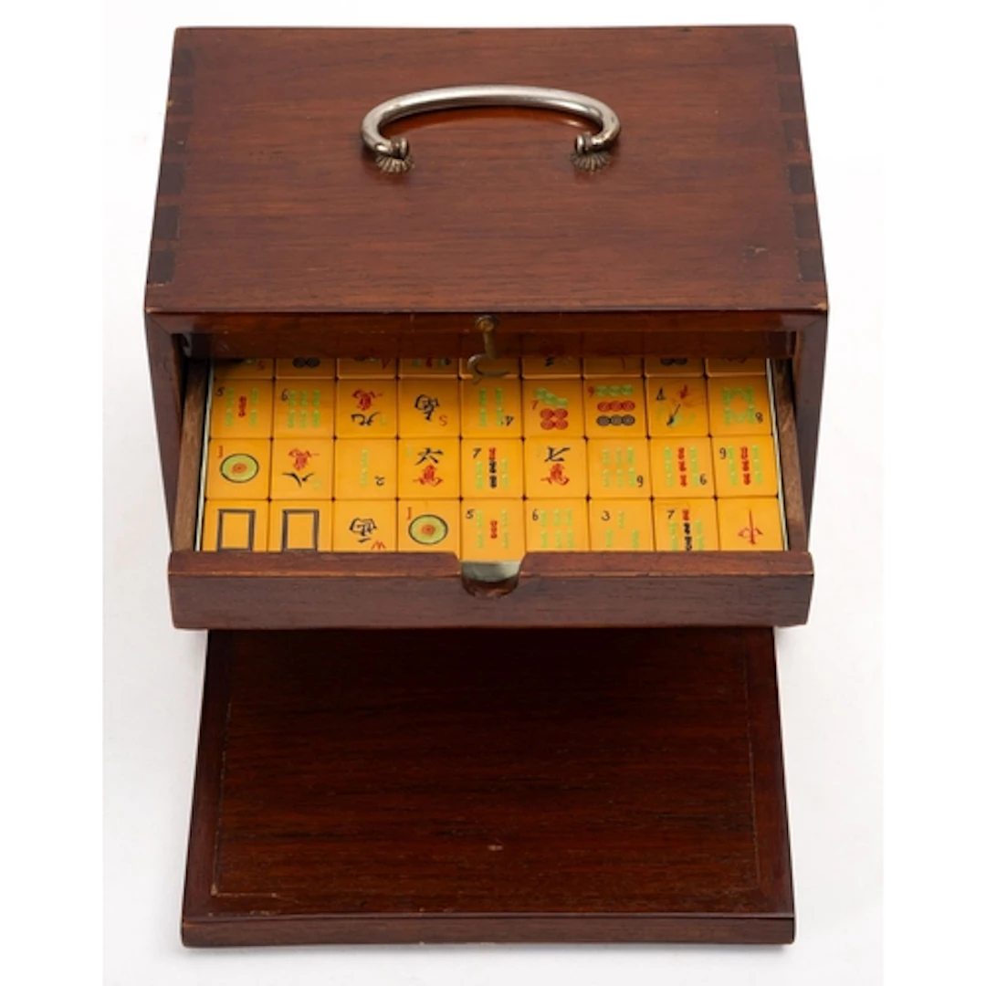 A modern cased Mah Jong set. The counters within a tabletop ...