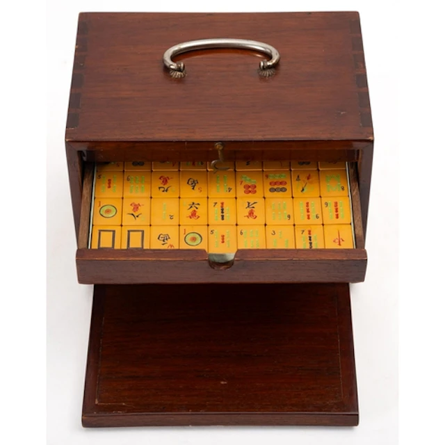 A modern cased Mah Jong set. The counters within a tabletop ...