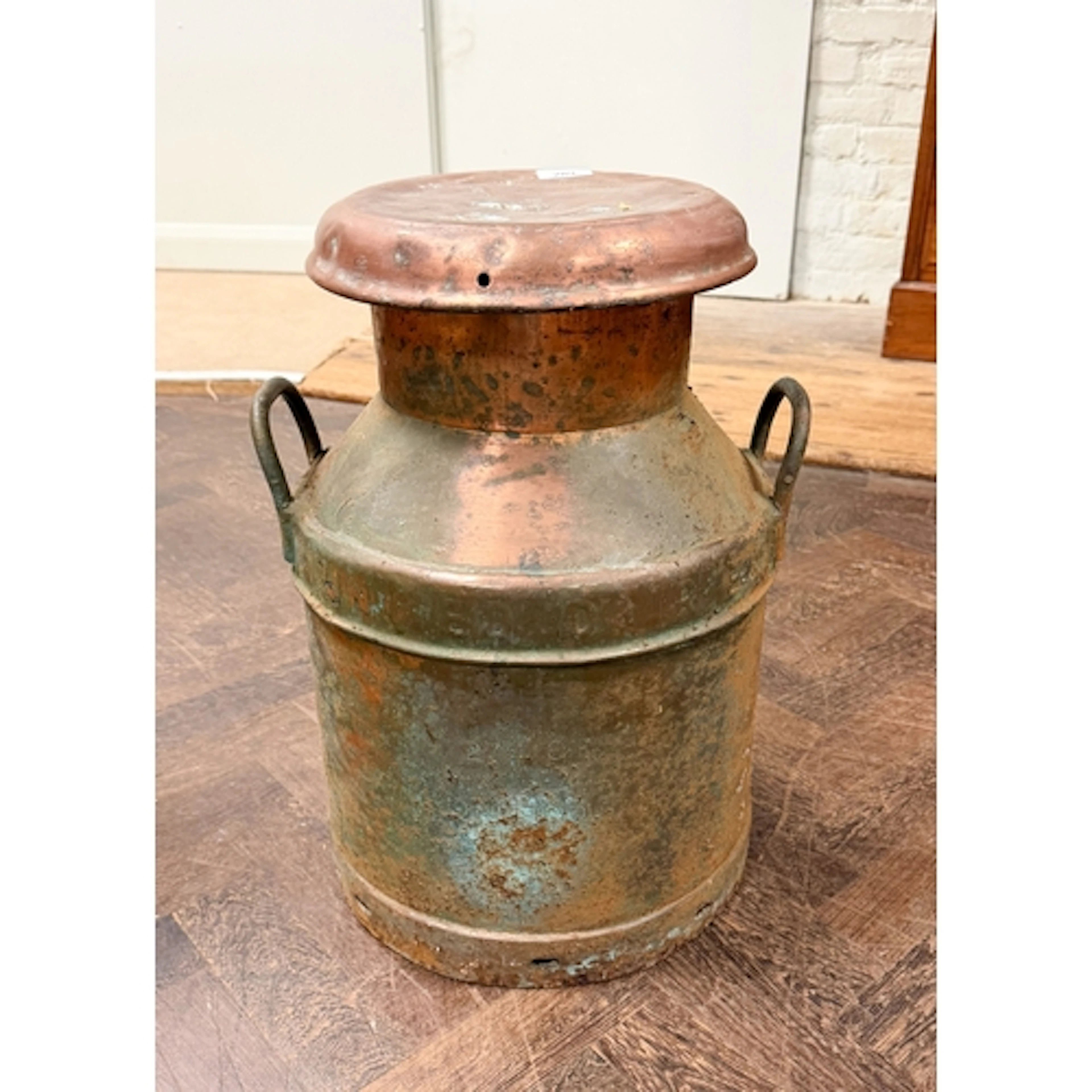 An old copper milk churn