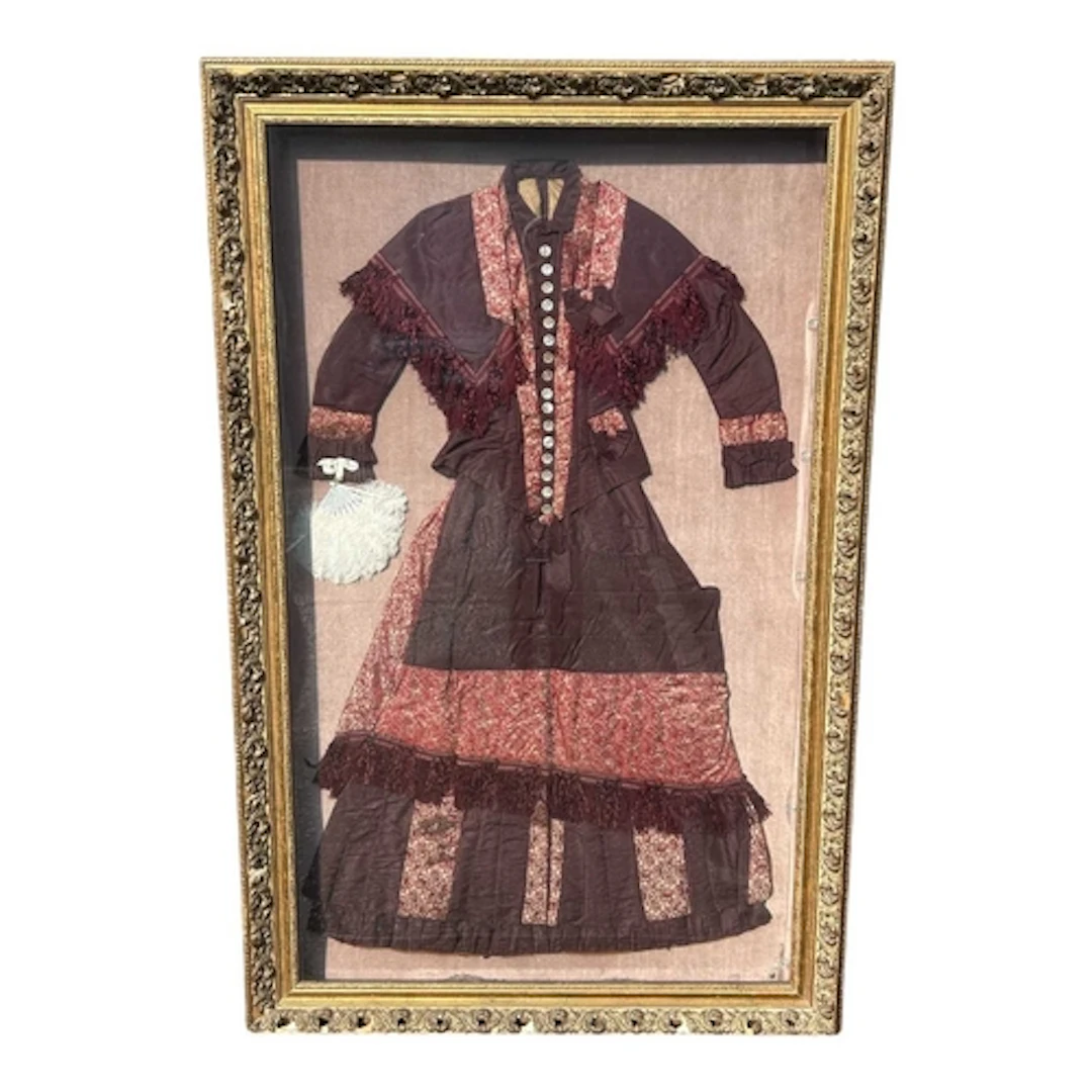 A 19TH CENTURY DRESS FROM NEW MEXICO, BROUGHT OVER FROM ENGL...