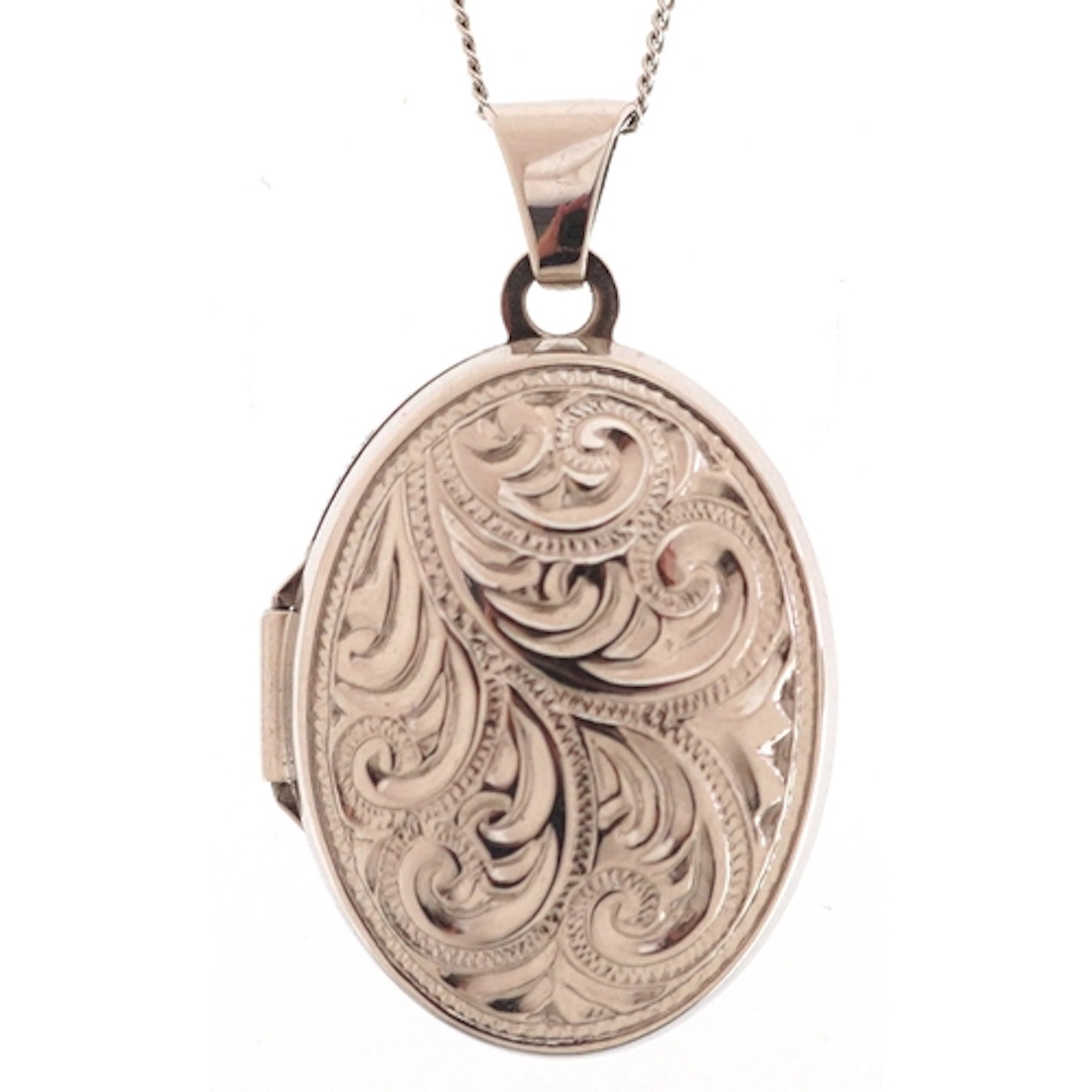 A 9ct white gold engraved locket on a 9ct white gold necklac...