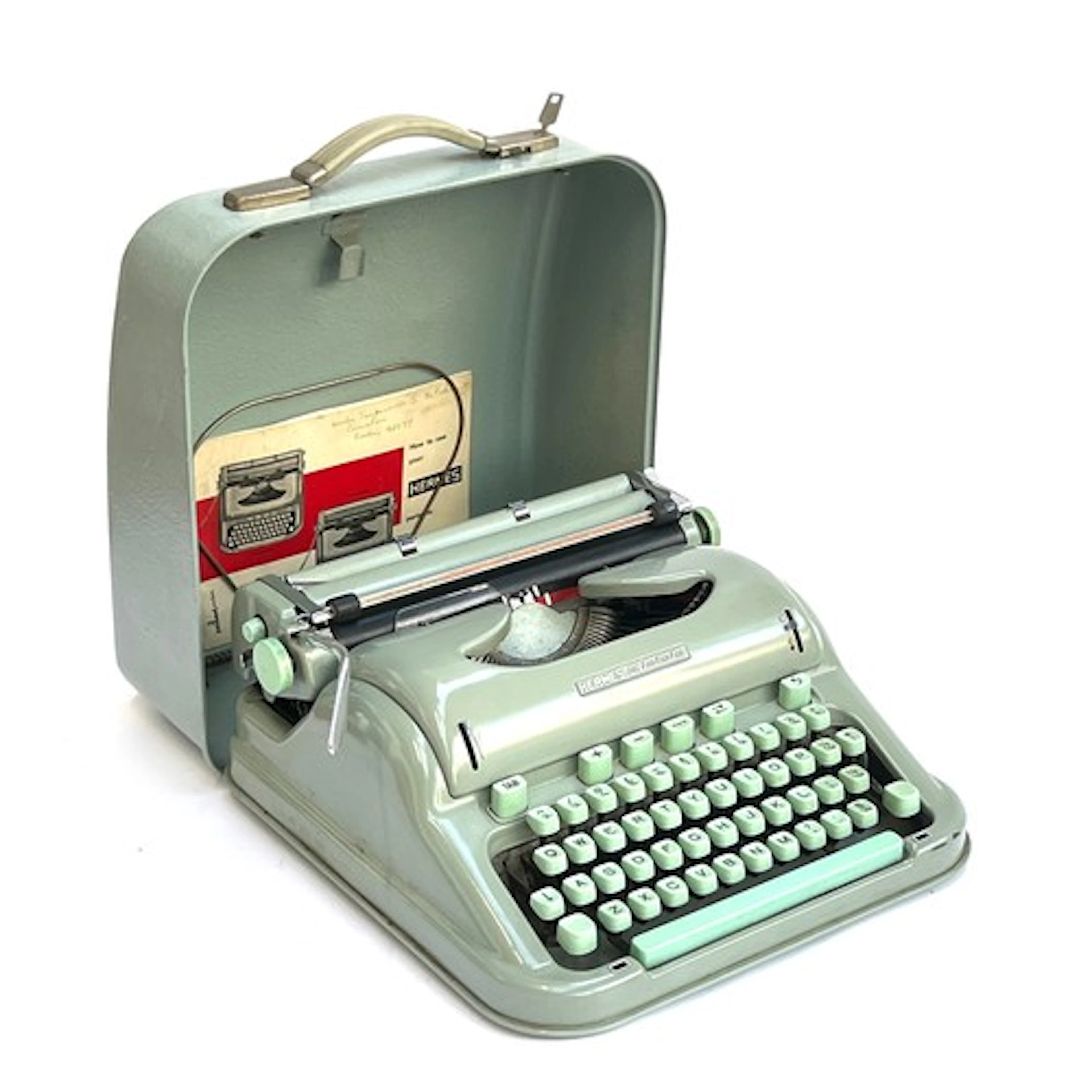 A Paillard Hermes 3000 portable typewriter with user manual ...
