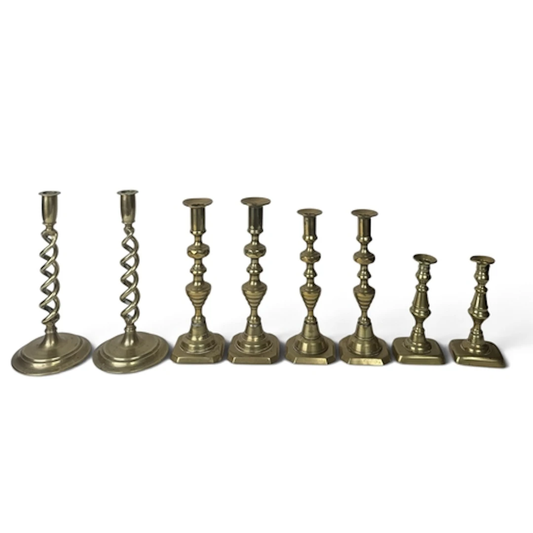 FOUR PAIRS OF BRASS CANDLESTICKS Tallest 29cm