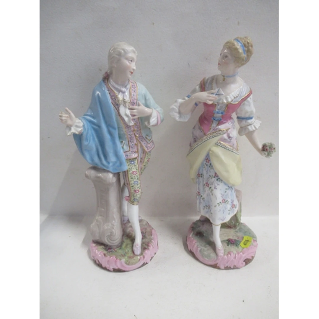 A pair of French Vion & Baury figures, of a man and a woman,...