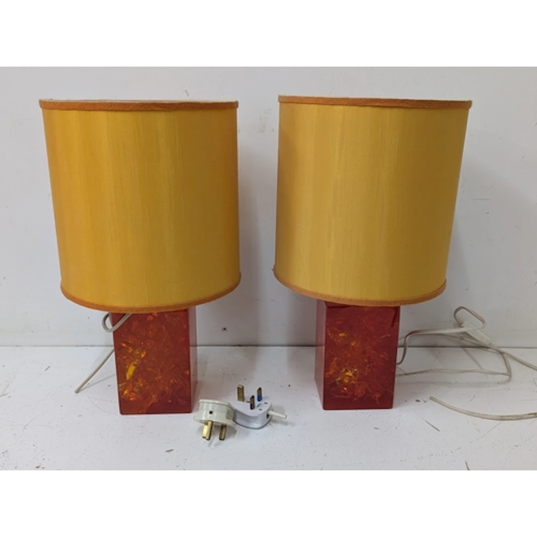 A pair of retro orange plastic lamp bases Location: If there...