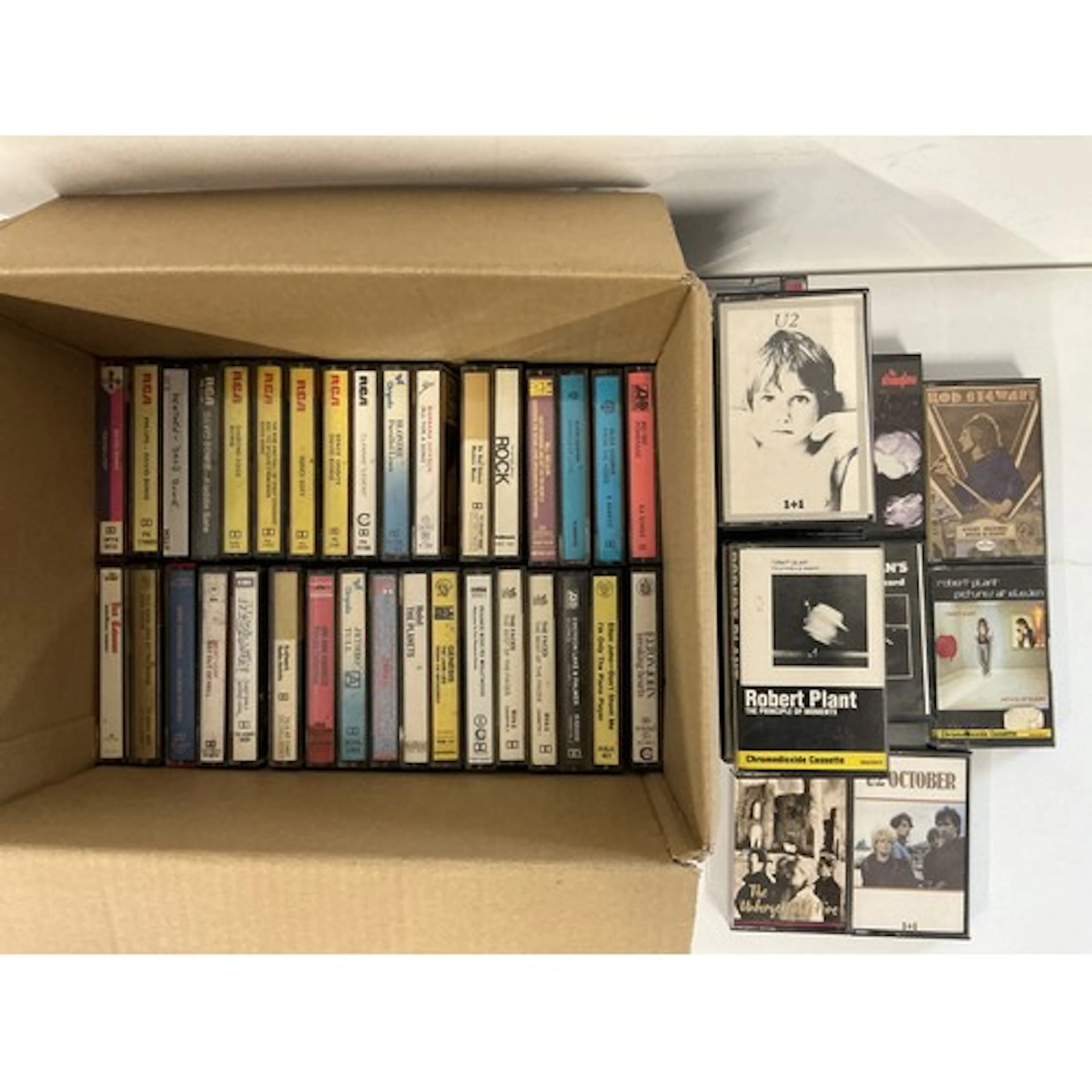 A collection of audio cassettes by various artists including...