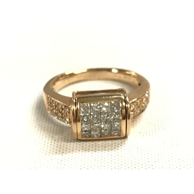A 14ct gold ring diamond stone set barrel roll, 5.3g size L