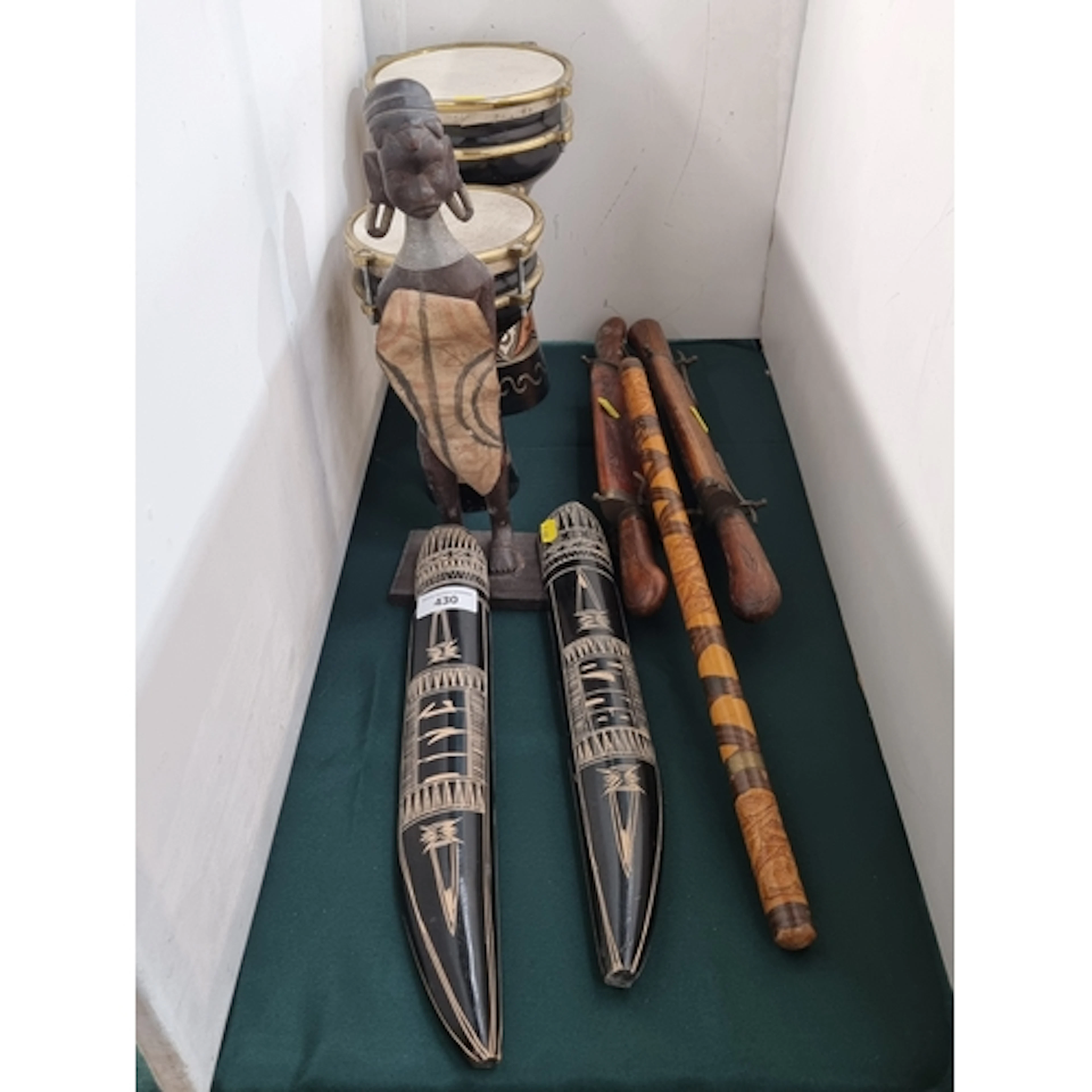 A selection of African tourist items including two Drums, a ...