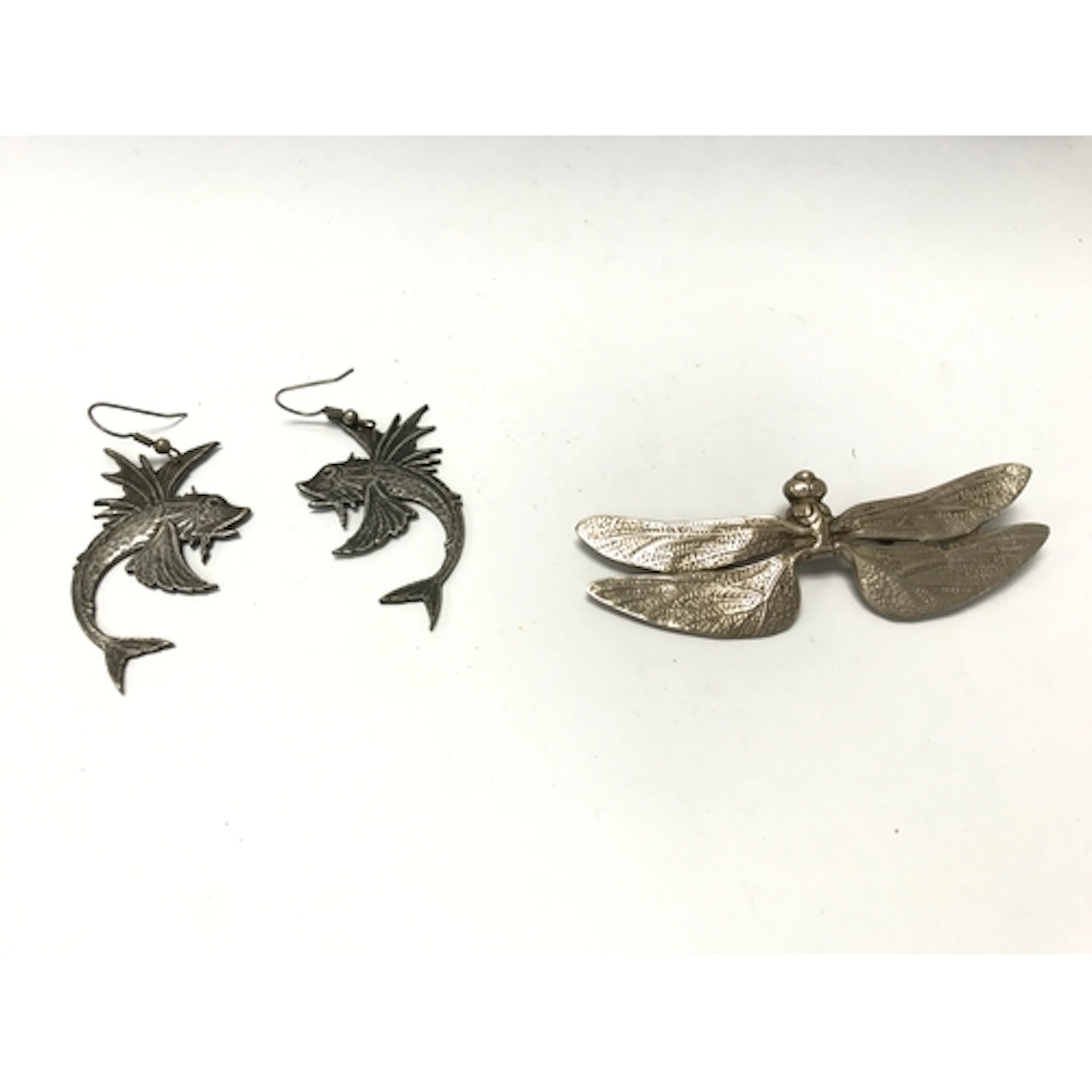 silver dragonfly pin or brooch with intricately textured win...
