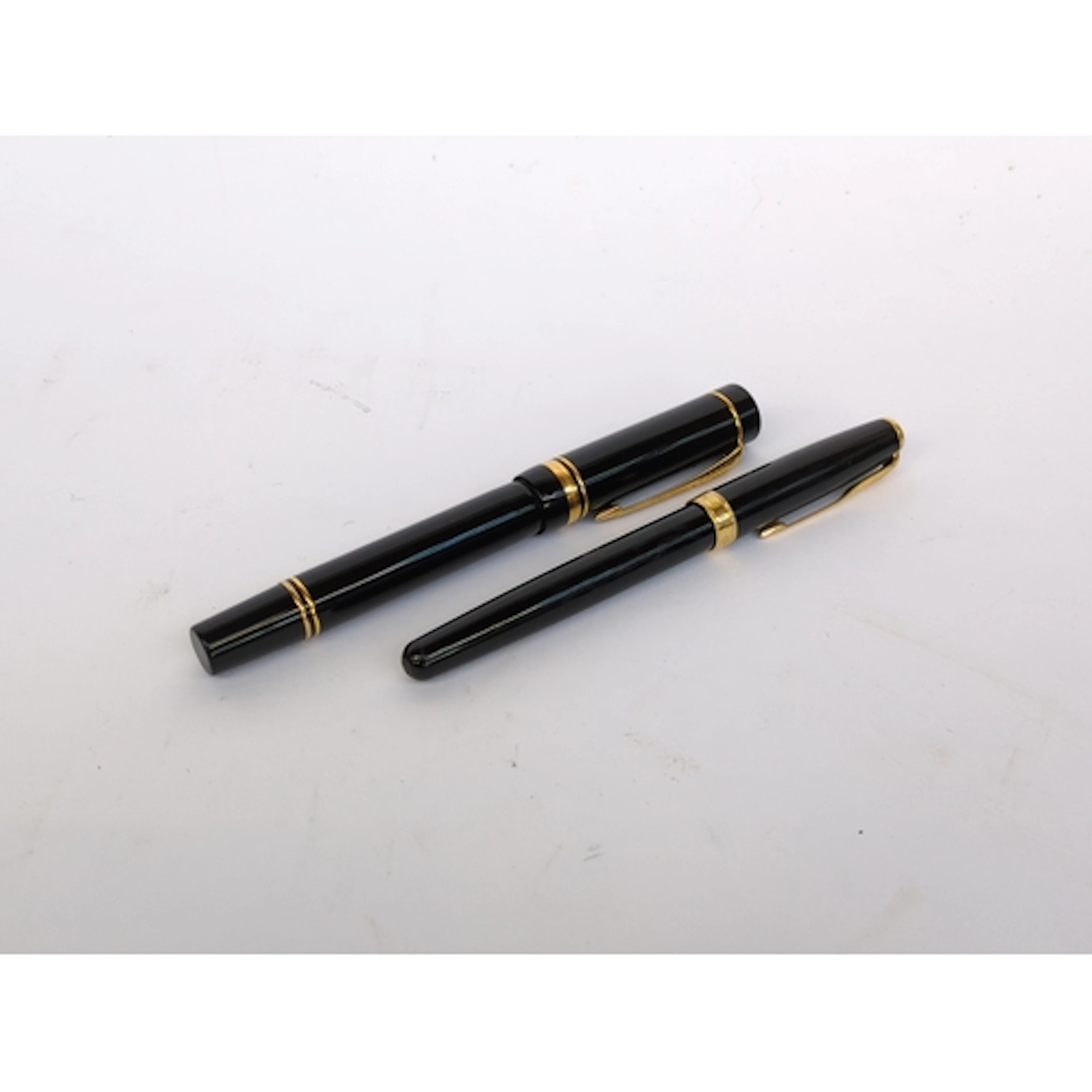 A Parker Sonnet fountain pen, together with a further, large...