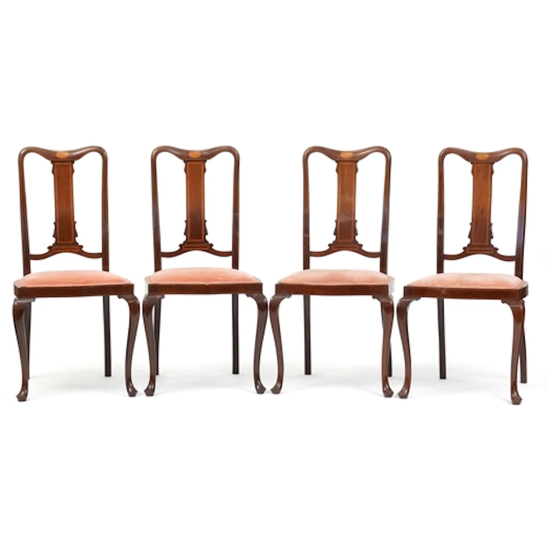 Set of four Edwardian mahogany dining chairs, the shaped bac...