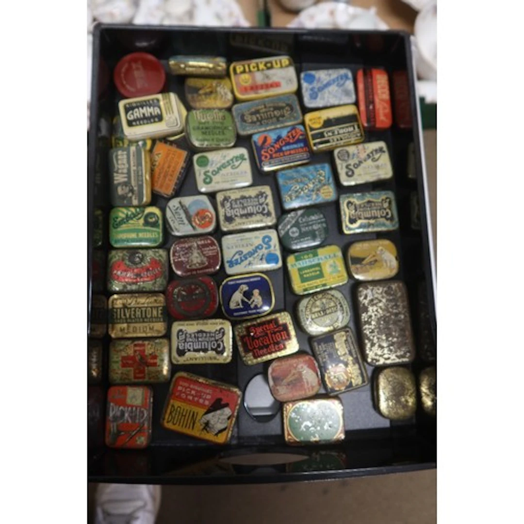 A tray of vintage gramphone needle tins