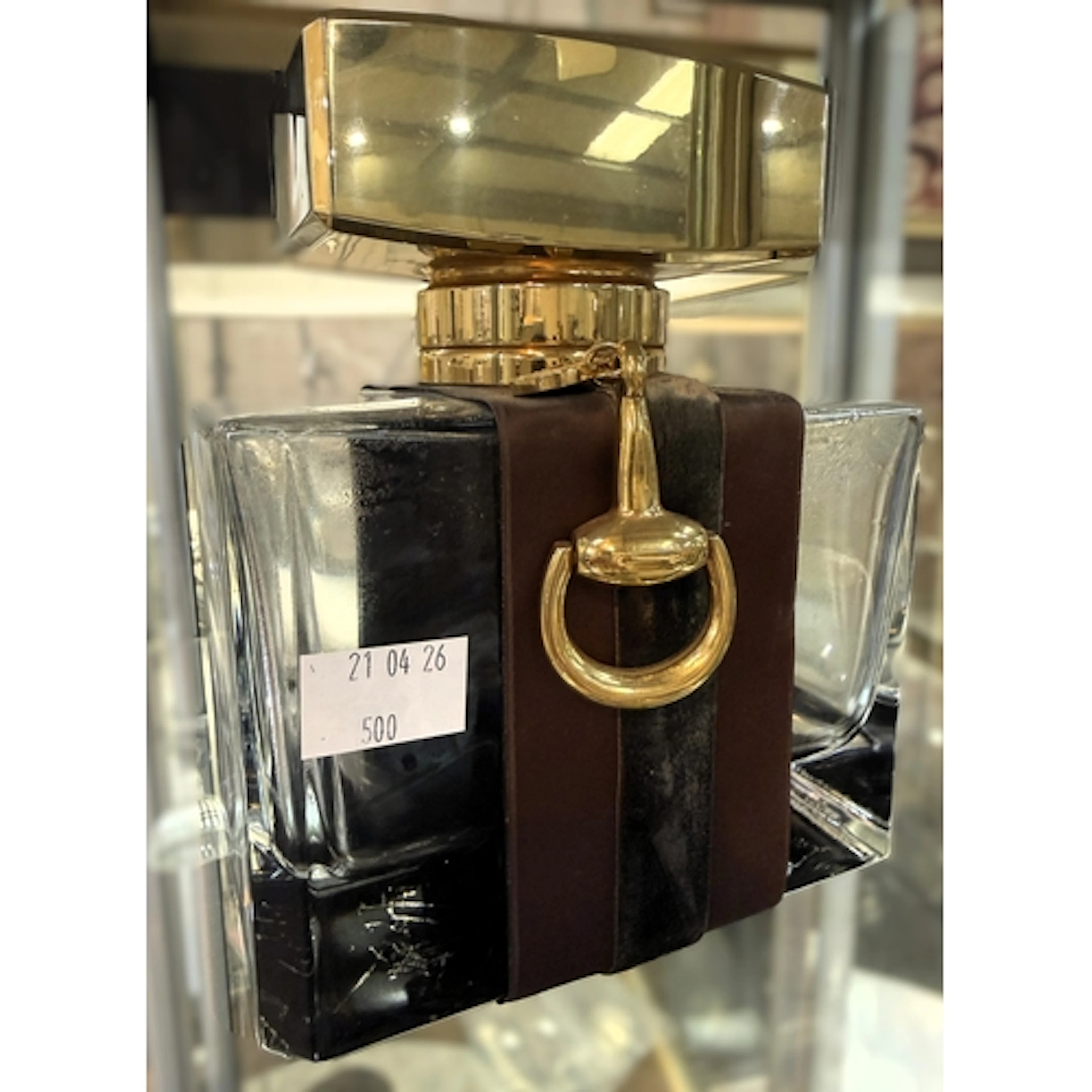 A large scale advertising perfume bottle with Gucci label, h...