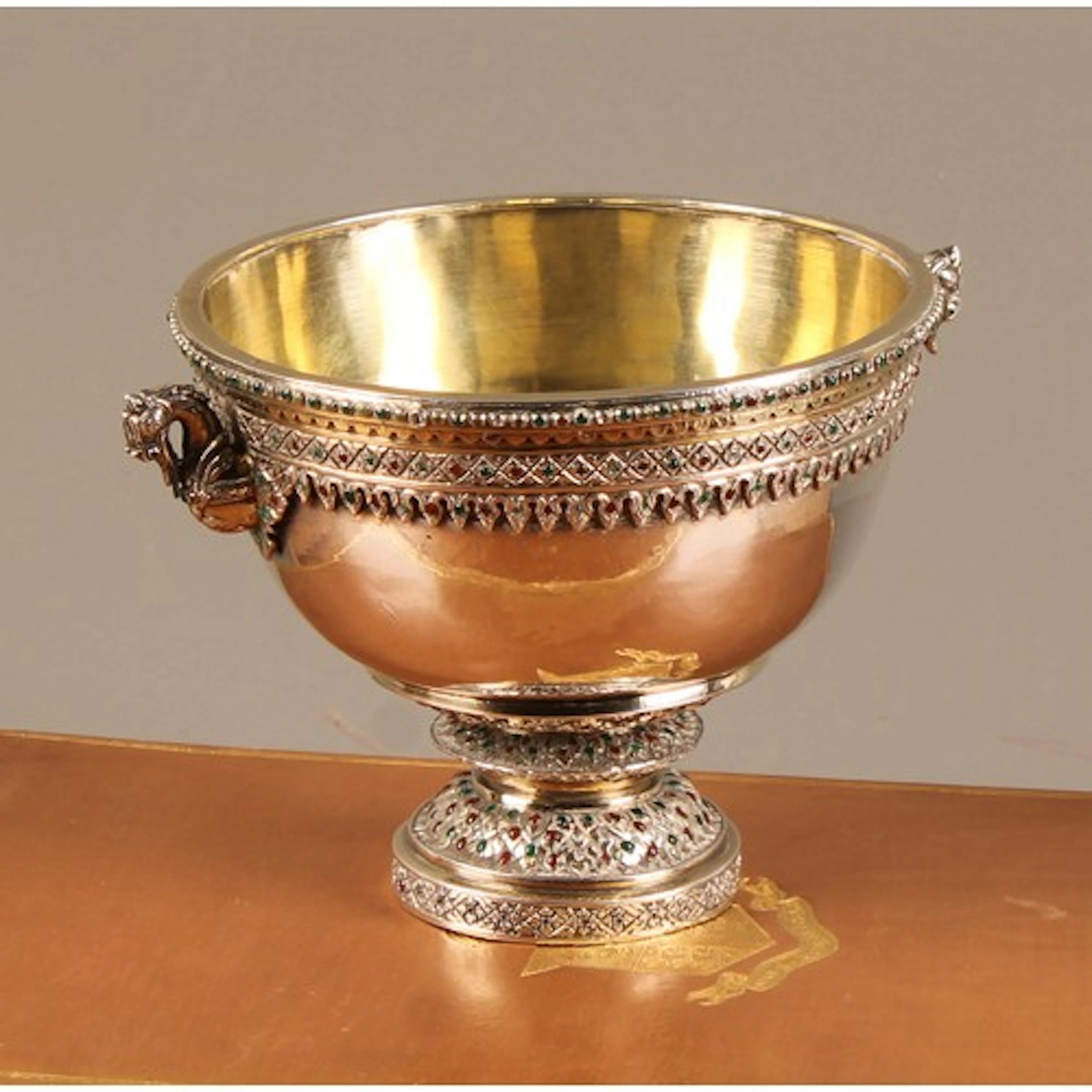 A Continental Arts and Crafts silver coloured metal pedestal...