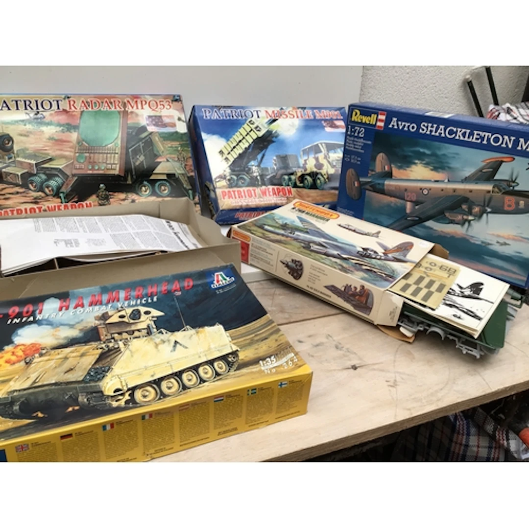 A collection of boxed model aircraft and vehicles by manufac...