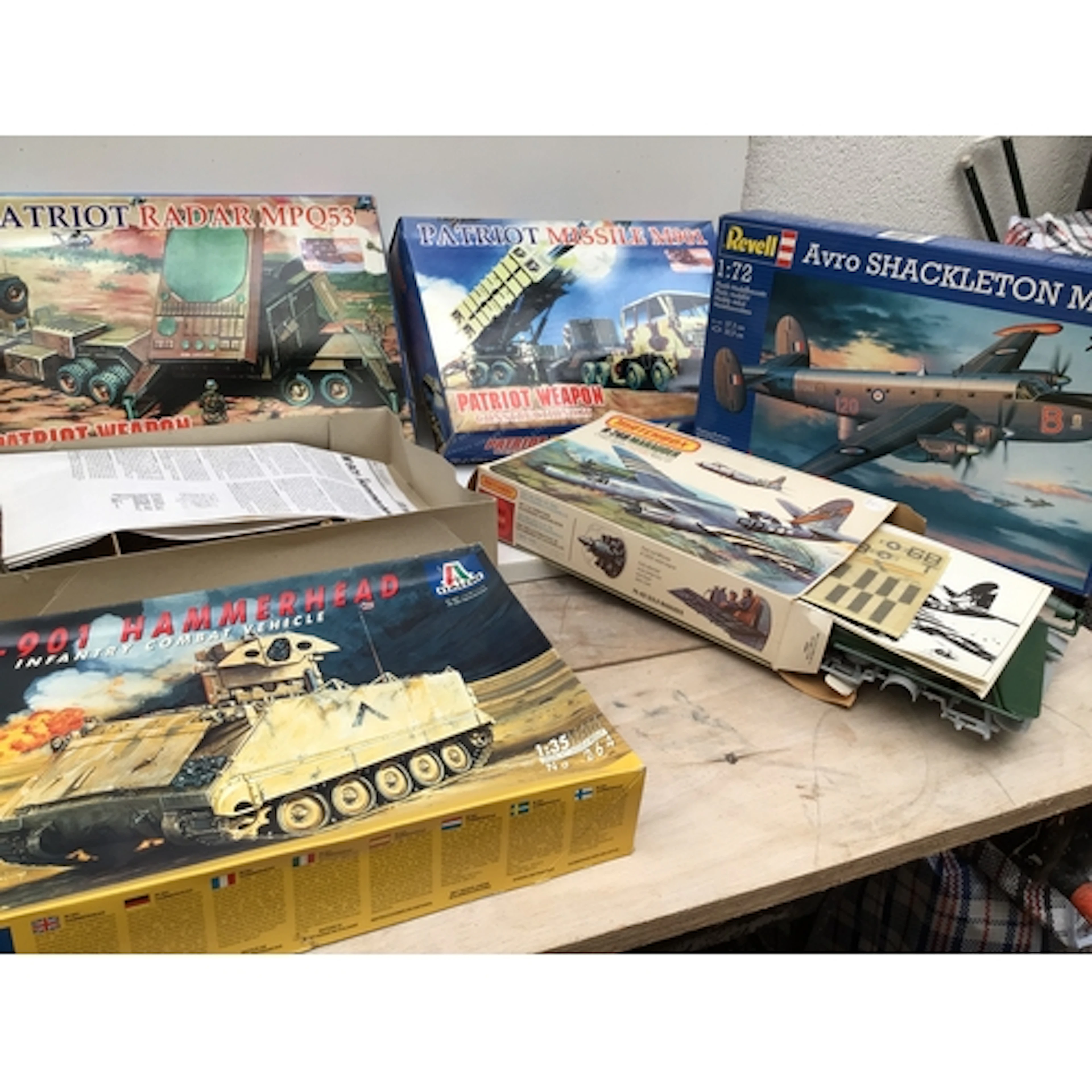 A collection of boxed model aircraft and vehicles by manufac...