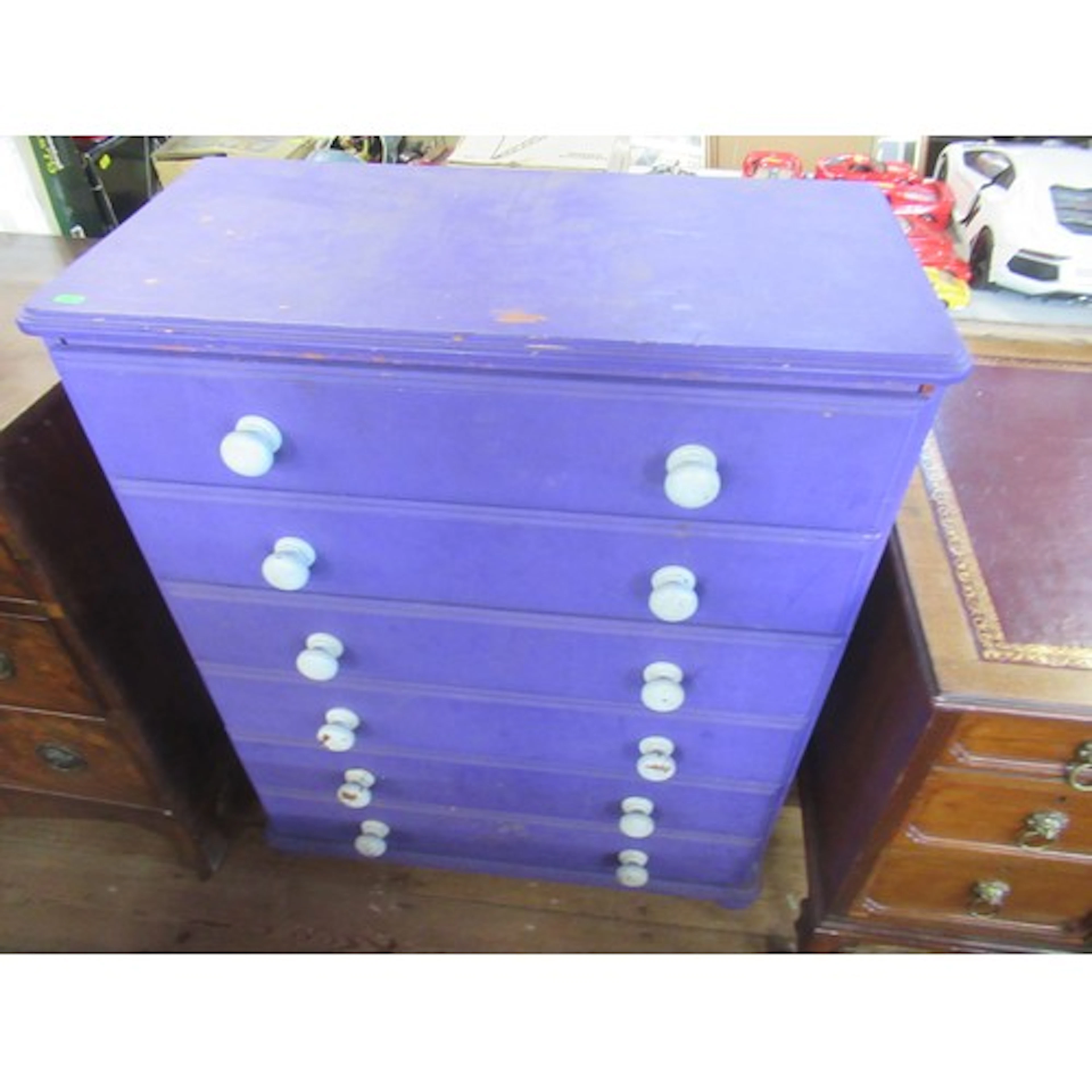 A purple chest of drawers and contents (large collection of ...