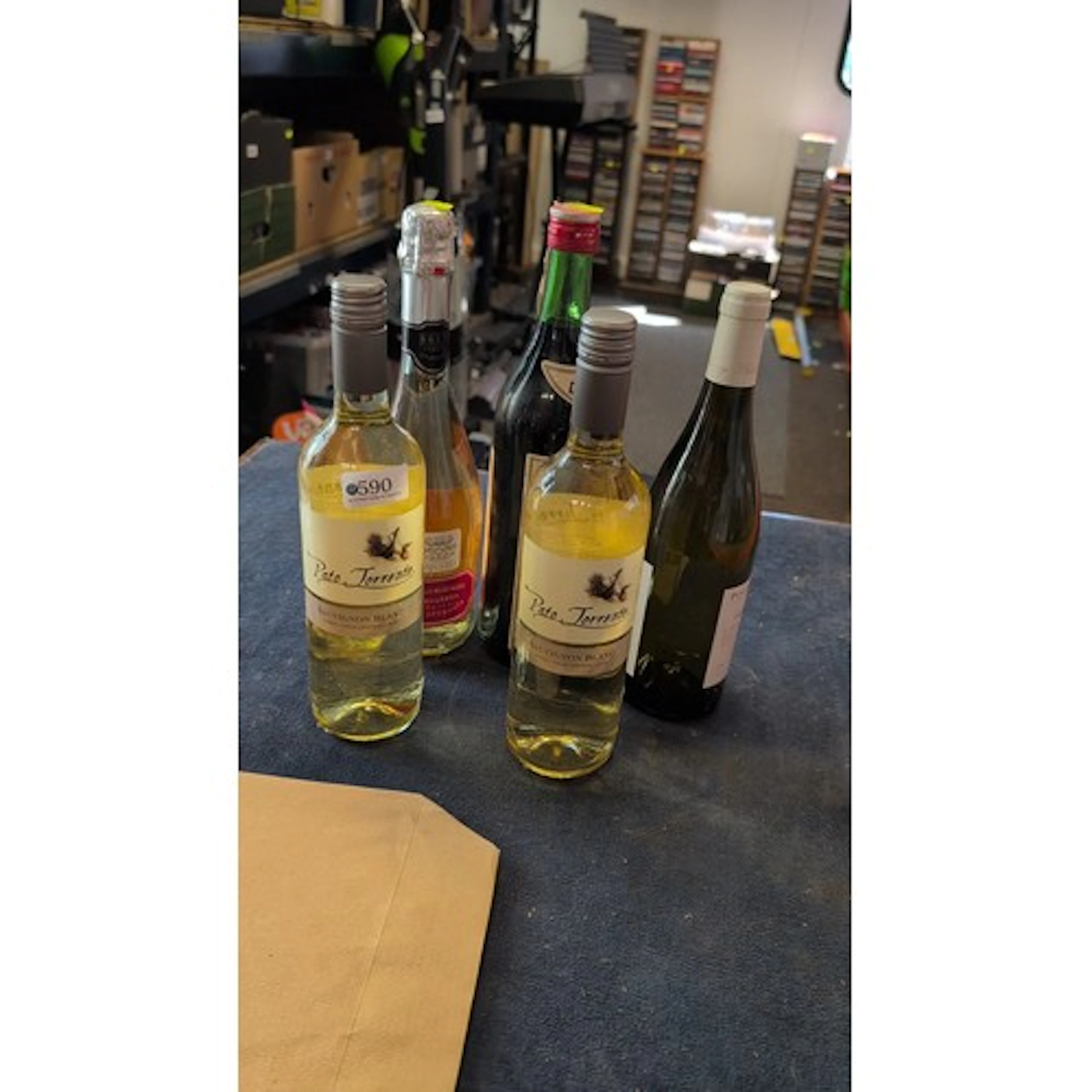 An assortment of bottled alcoholic beverages, including two ...