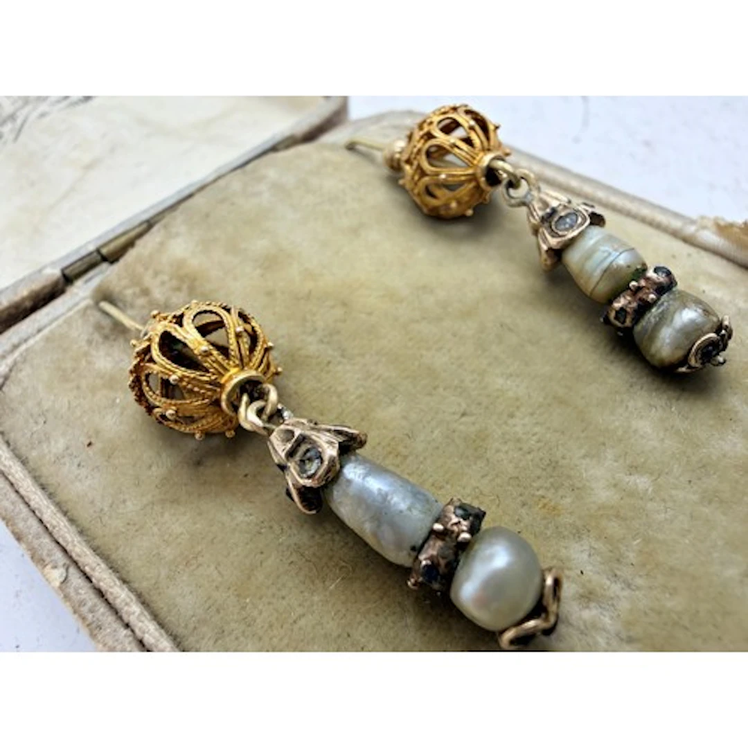 A pair of pendant earrings incorporating finely worked gold ...