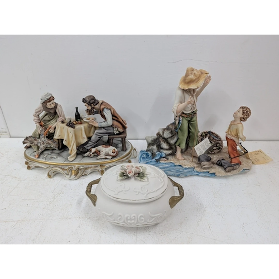 Capodimonte to include two figural groups and a twin handled...