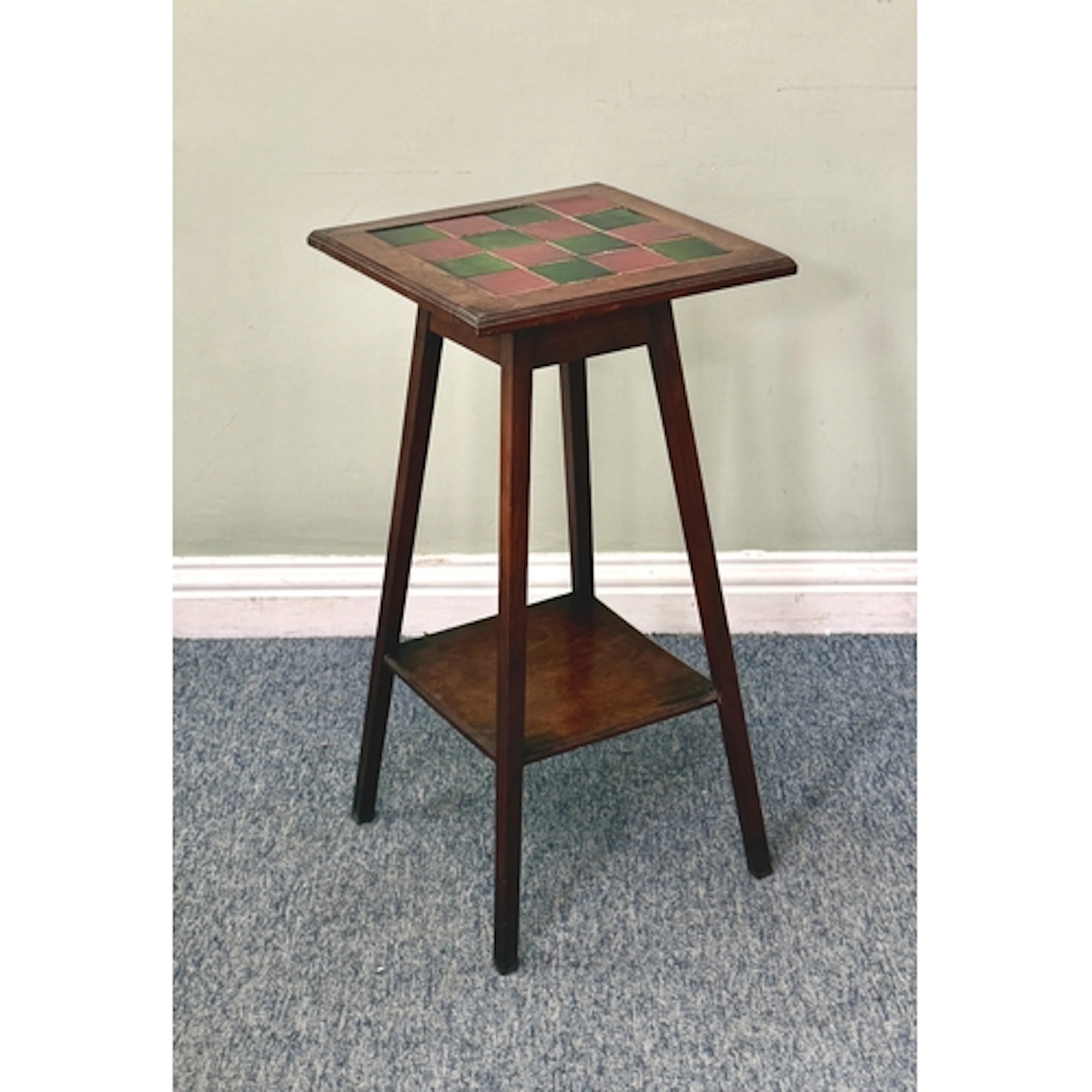 An early 20th century tile-top walnut lamp table or jardinie...